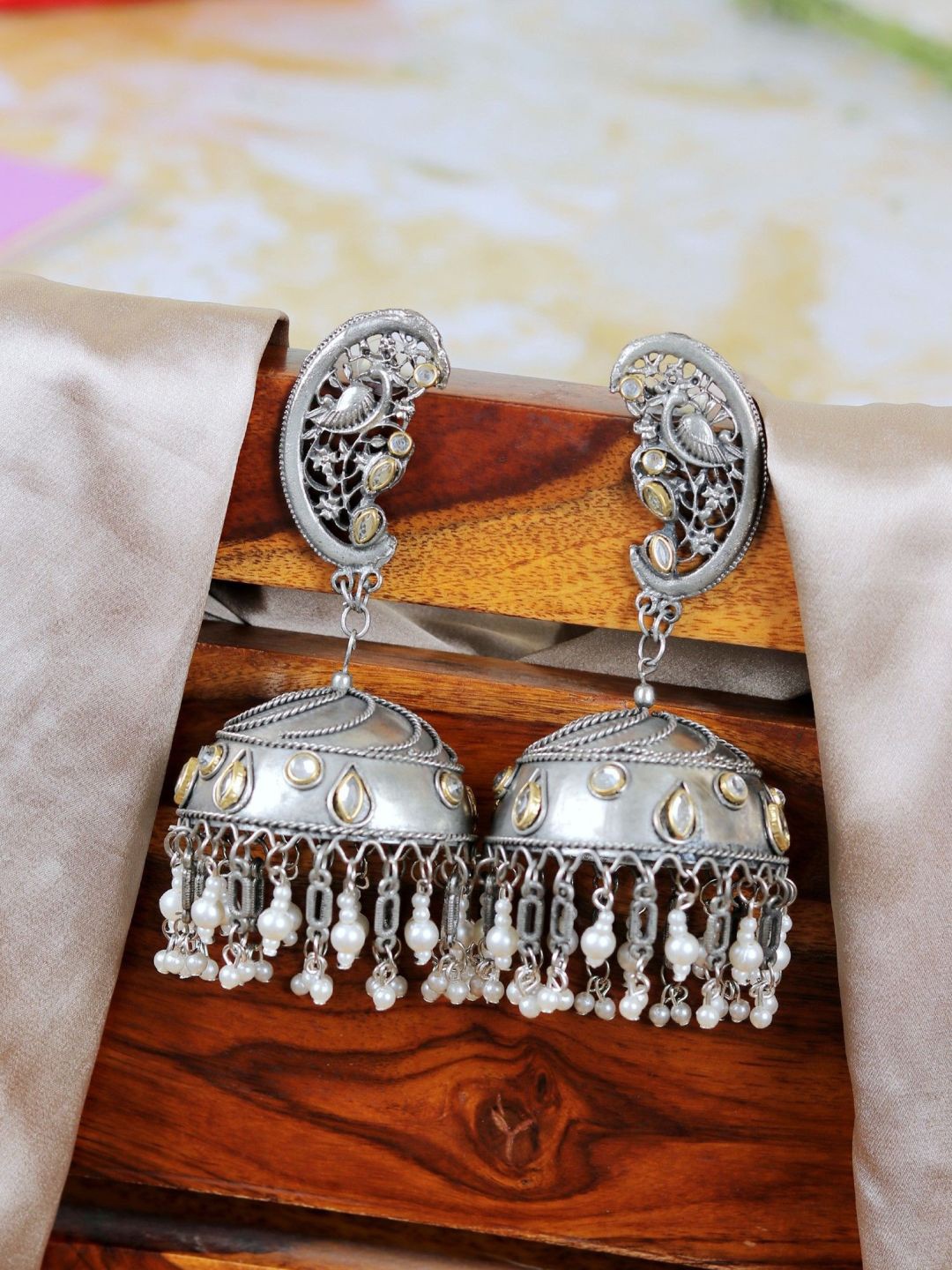 

Crunchy Fashion Silver-Plated Dome Shaped Stone-Studded Brass Oxidised Jhumkas