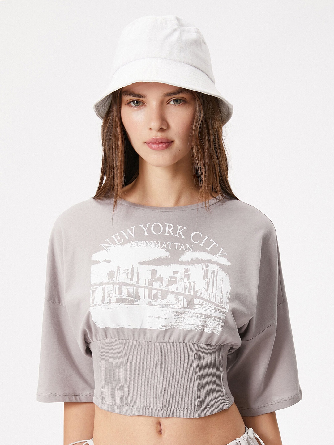 

Koton Graphic Printed Drop-Shoulder Sleeves Crop T-Shirt, Beige