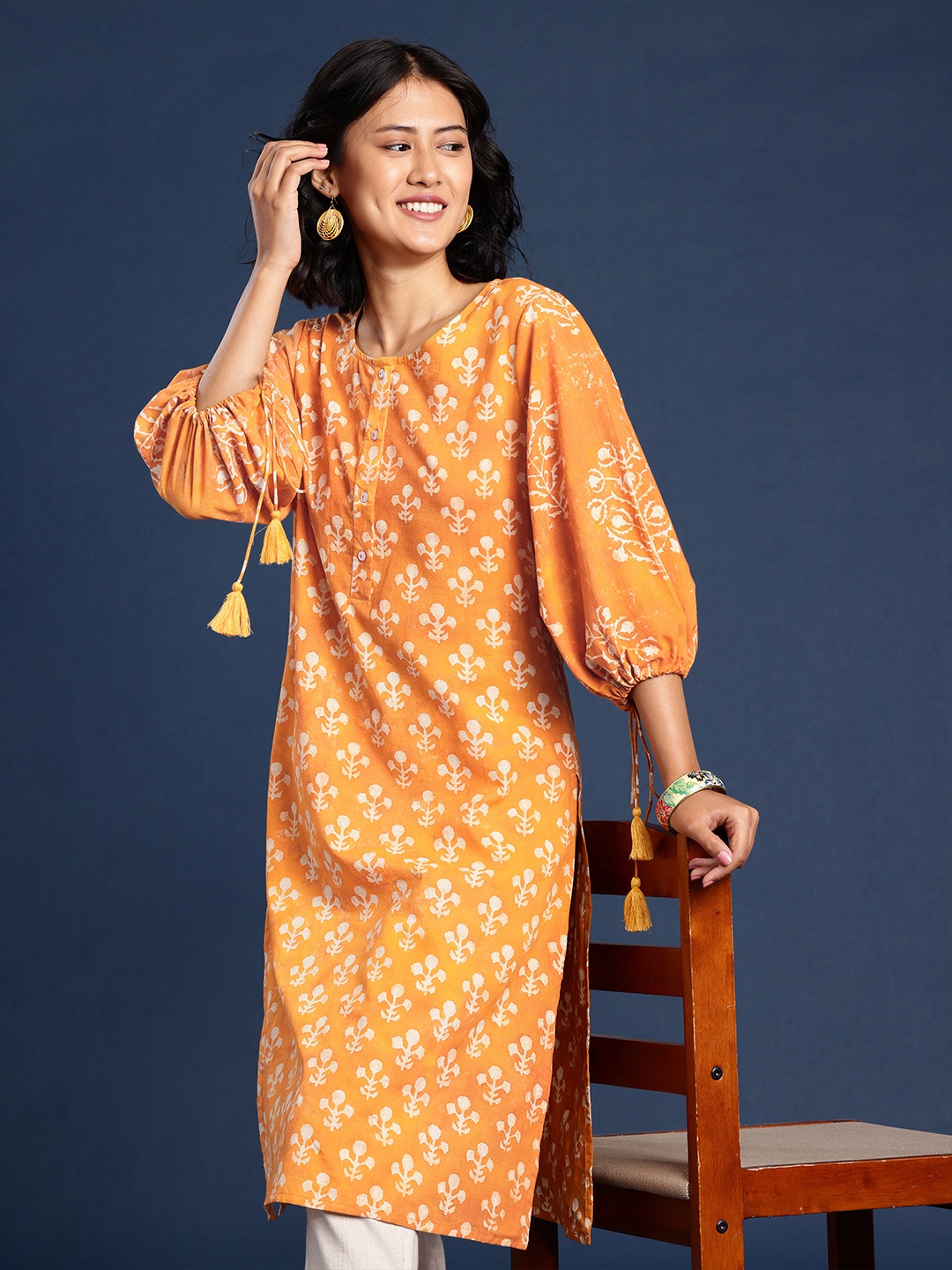 

Taavi Rangeen Dabu Pure Cotton Ethnic Motifs Printed Flared Sleeves Kurta, Yellow