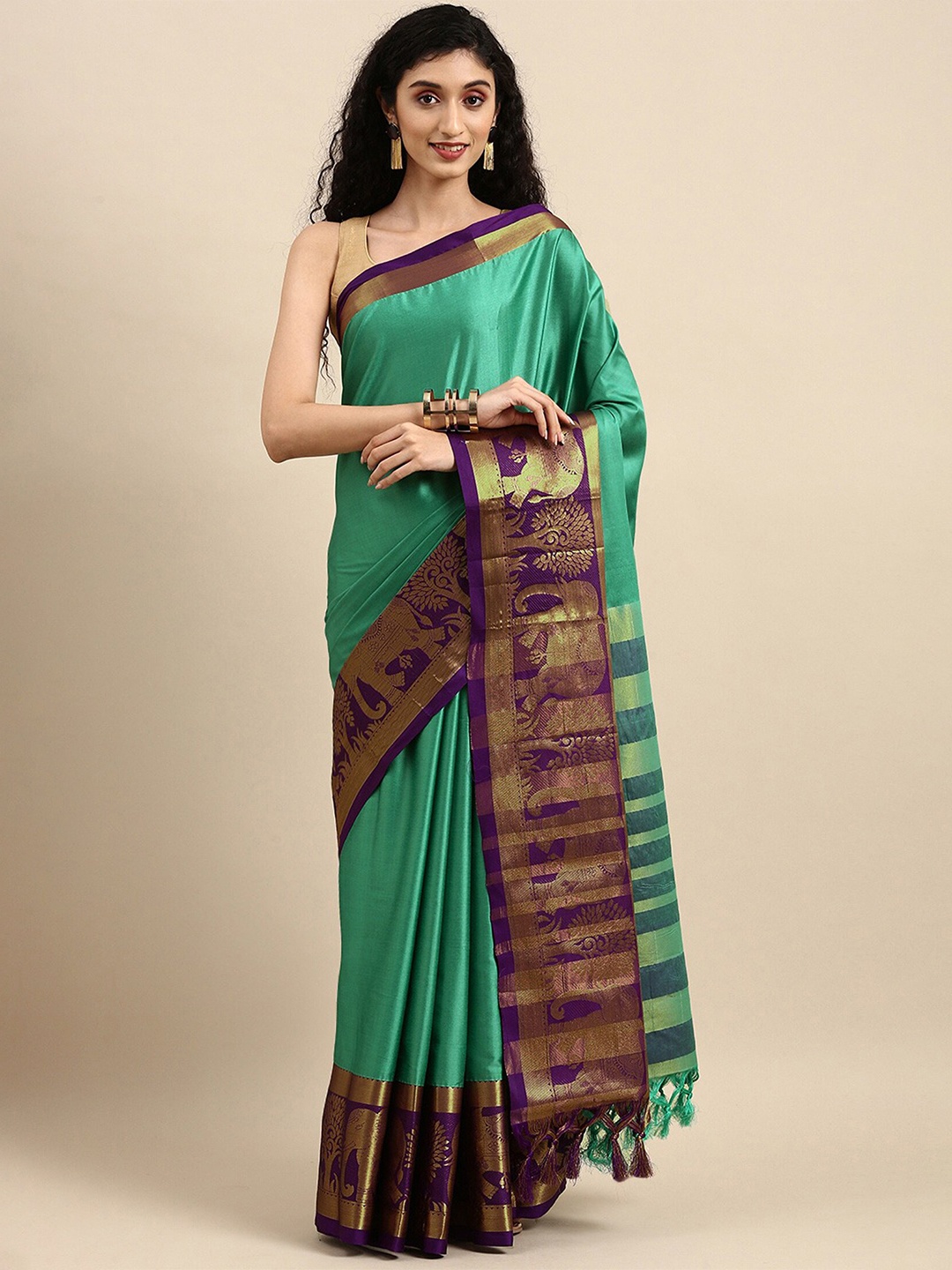 

Mitera Teal & Purple Ethnic Motifs Woven Design Zari Silk Cotton Saree