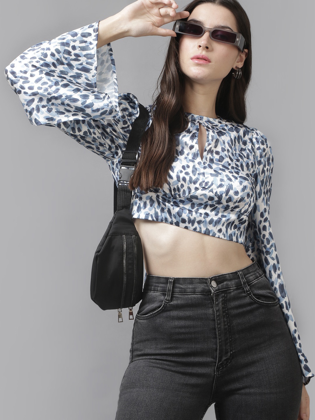 

Roadster White Abstract Printed Keyhole Neck Bell Sleeves Tie-Ups Styled Back Crop Top