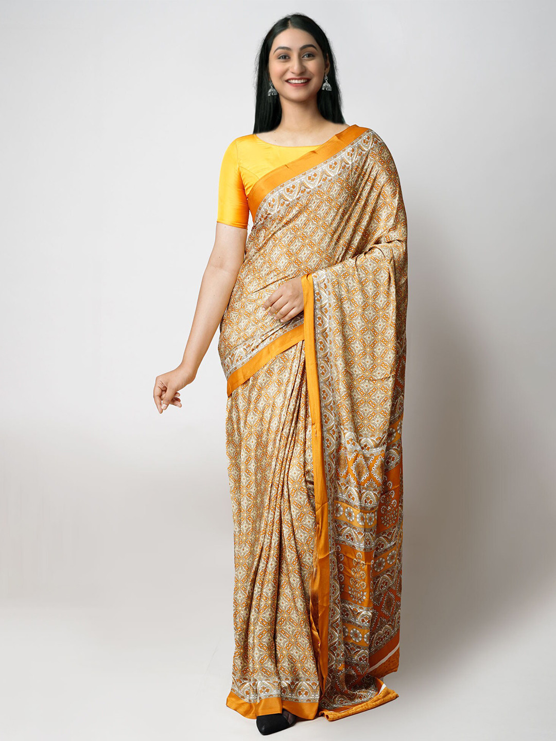 

Unnati Silks Ethnic Motifs Printed Block Print Saree, Yellow