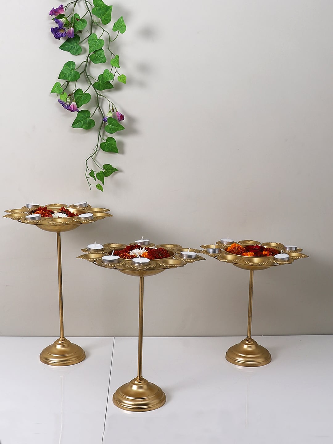 

Aapno Rajasthan Golden 3 Pieces Petals Design Urli Diya Stand, Gold