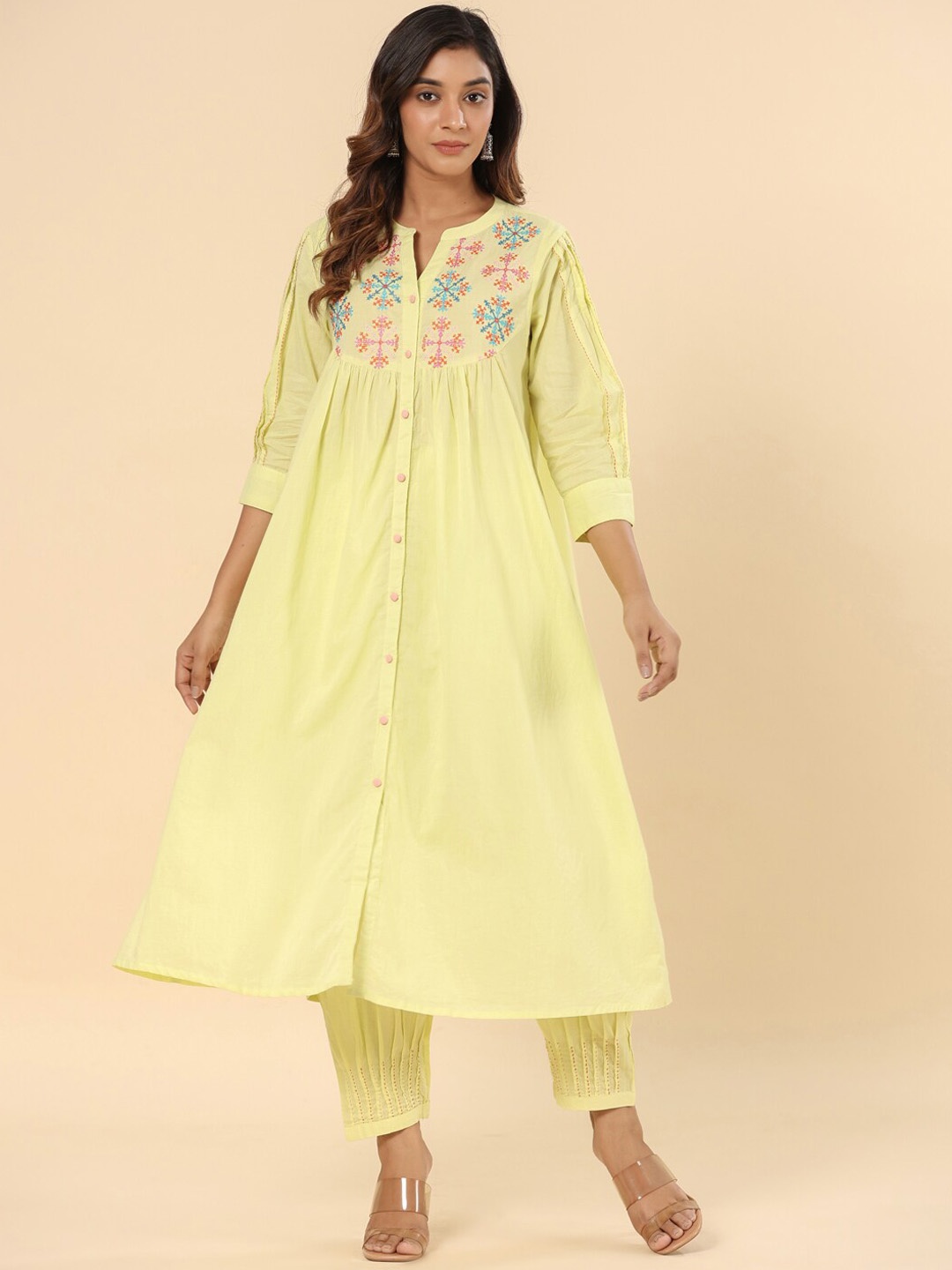 

SAVI Lemon Cotton Embroidered A Line Kurta Trouserss Set, Yellow