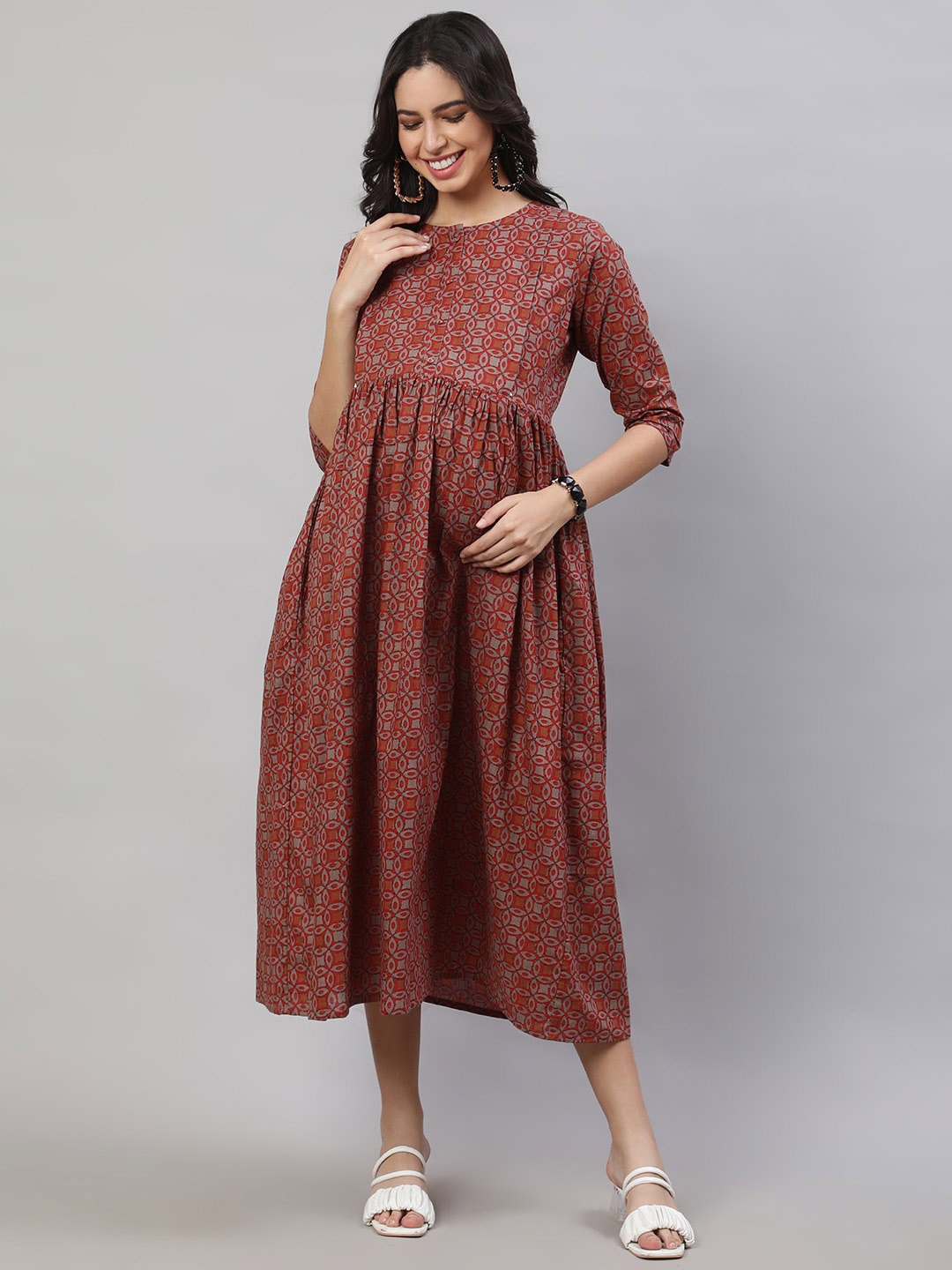 

Nayo Rust Ethnic Motifs Printed Gathered Cotton Maternity Fit & Flare Midi Ethnic Dress