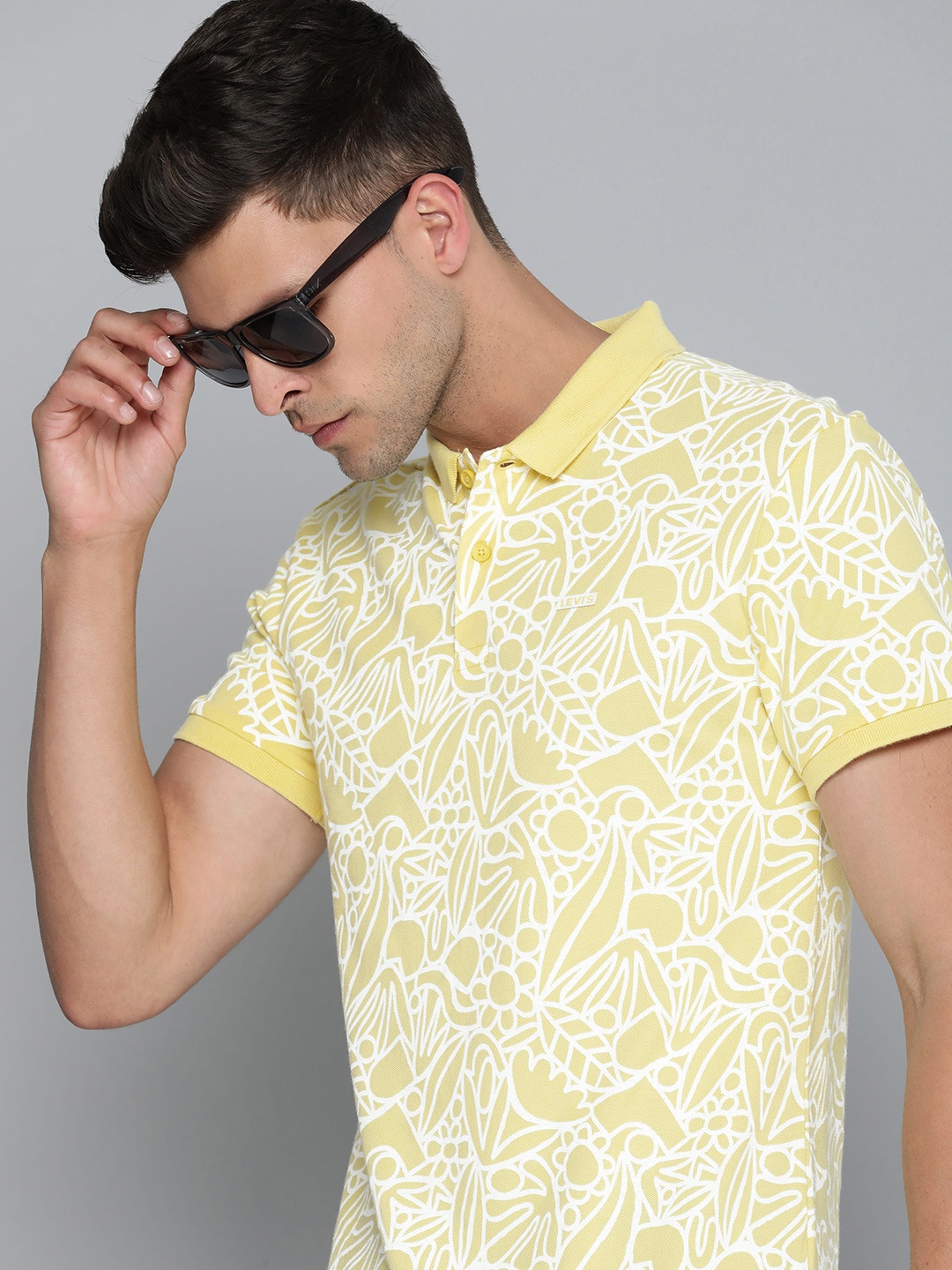 

Levis Men Abstract Printed Polo Collar Pure Cotton T-shirt, Yellow