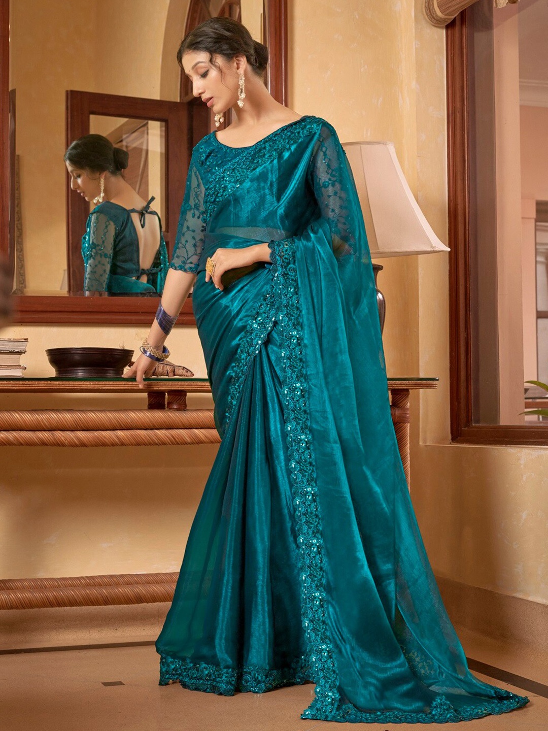 

Kalista Teal Blue Sequin Embellished Pure Chiffon Saree