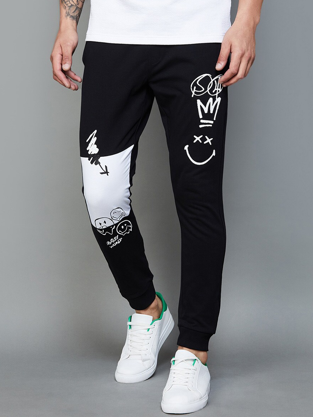 

SmileyWorld Men Mid Rise Graphic Printed Cotton Joggers, Black