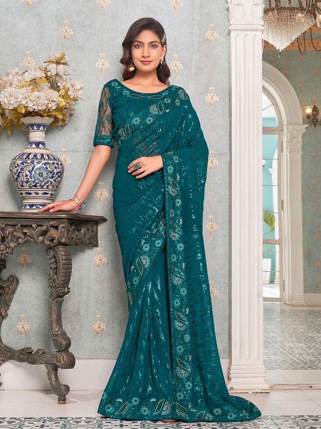 

Kalista Teal Embellished Sequinned Pure Georgette Saree