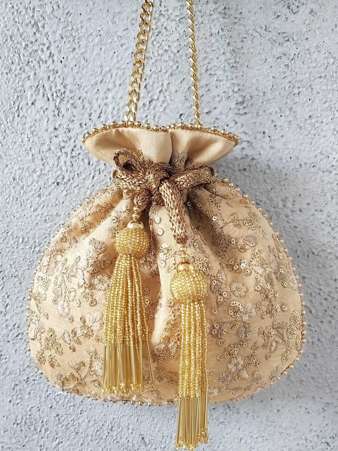 

AMYRA Embroidered Potli Bag With Tasselled, Beige