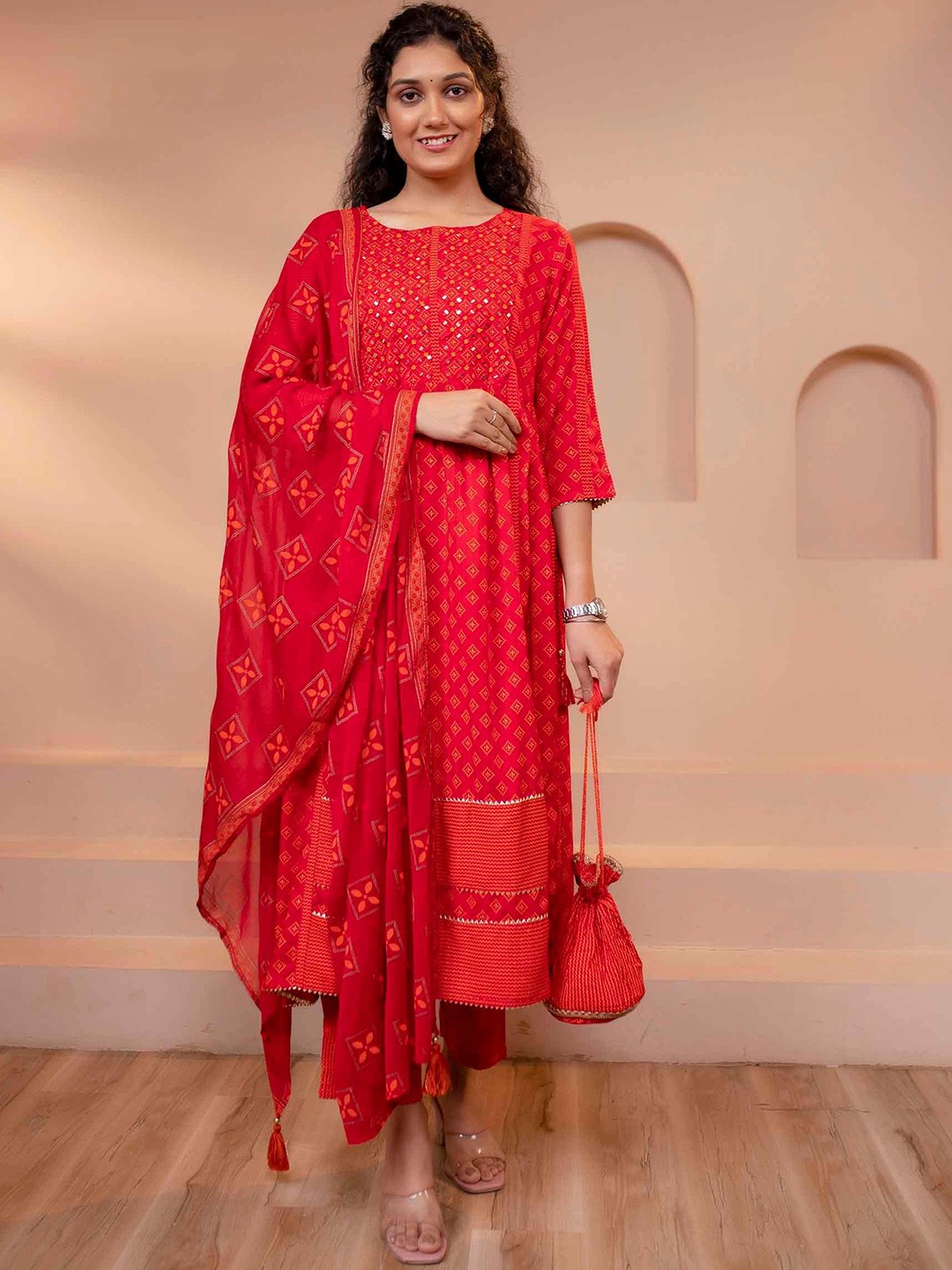 

KALINI Geometric Printed Mirror Work Anarkali Kurta With Trousers & Dupatta With Potli Set, Red