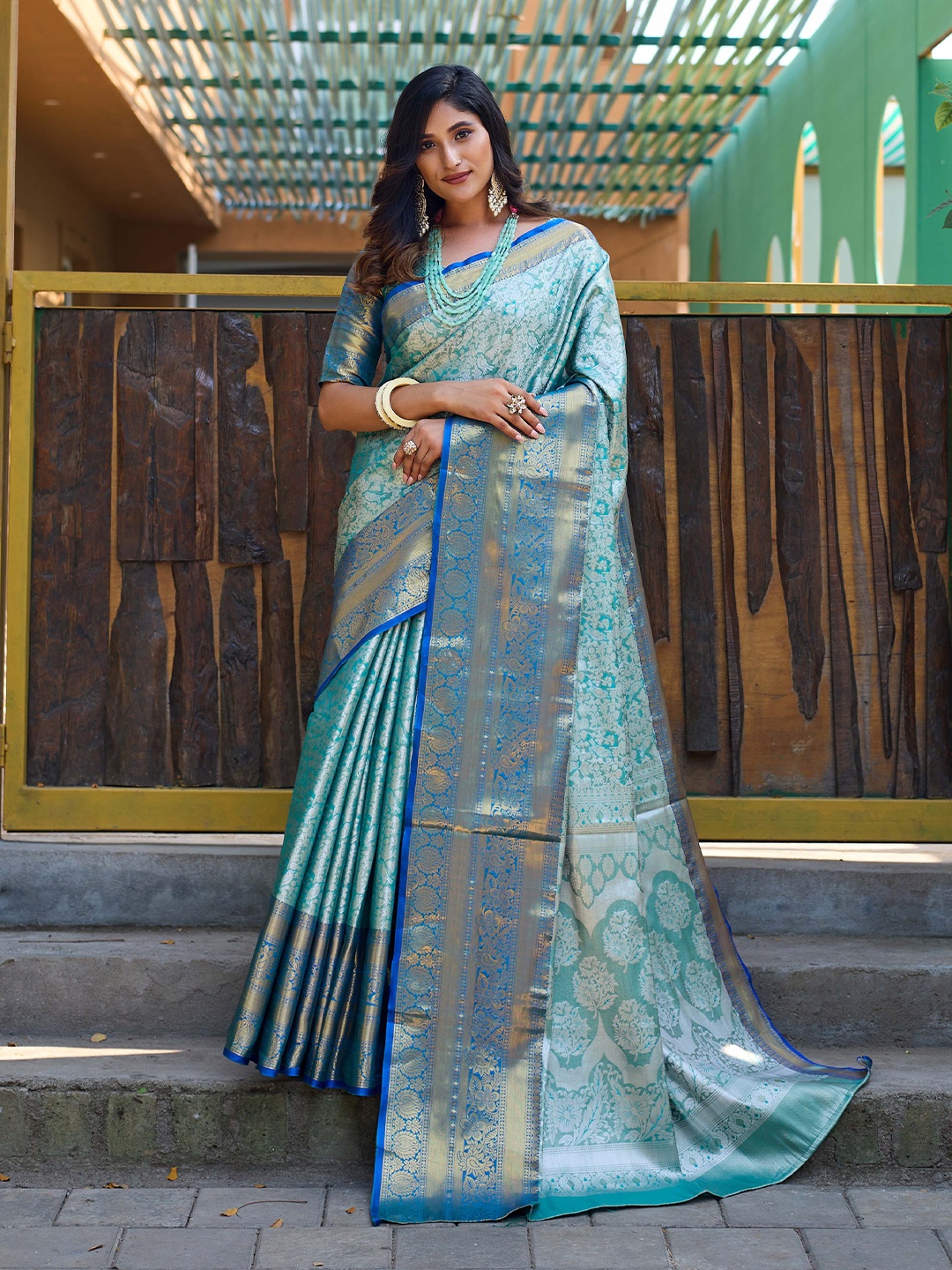 

Mitera Turquoise Blue & Blue Ethnic Motif Woven Design Zari Kanjeevaram Saree