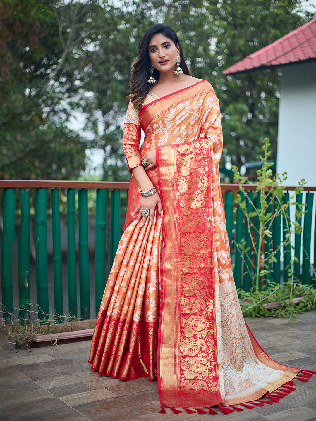 

Mitera Orange & Red Floral Woven Design Zari Kanjeevaram Saree