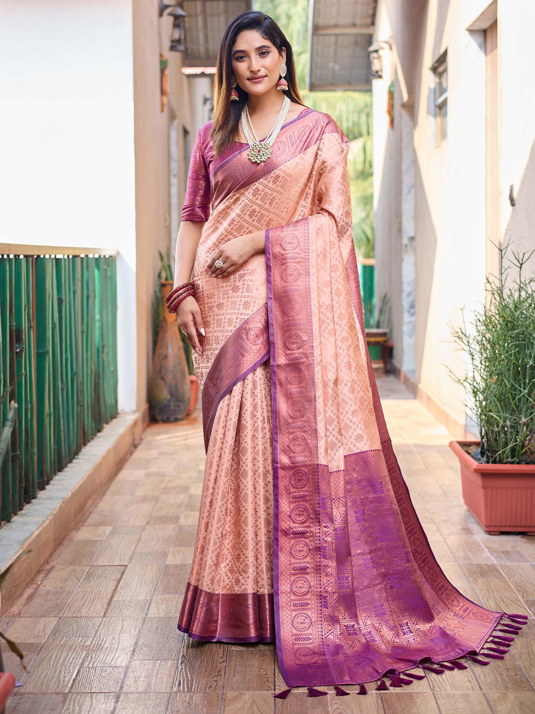 

Mitera Peach-Coloured & Purple Ethnic Motifs Woven Design Zari Kanjeevaram Saree