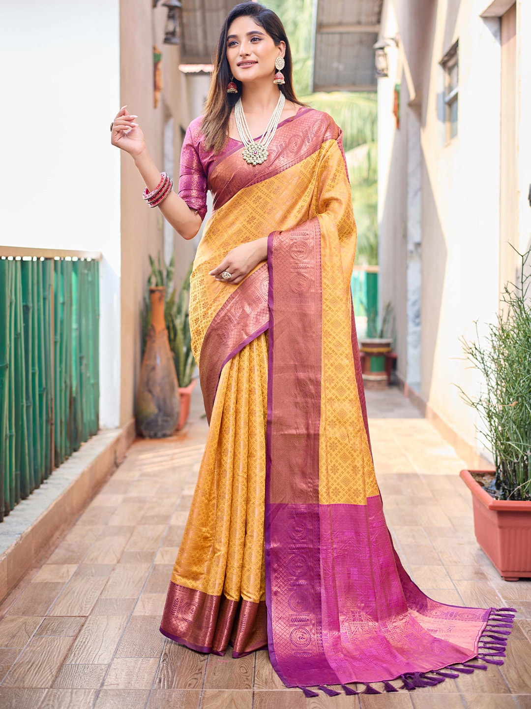 

Mitera Mustard & Purple Ethnic Motifs Woven Design Zari Kanjeevaram Saree