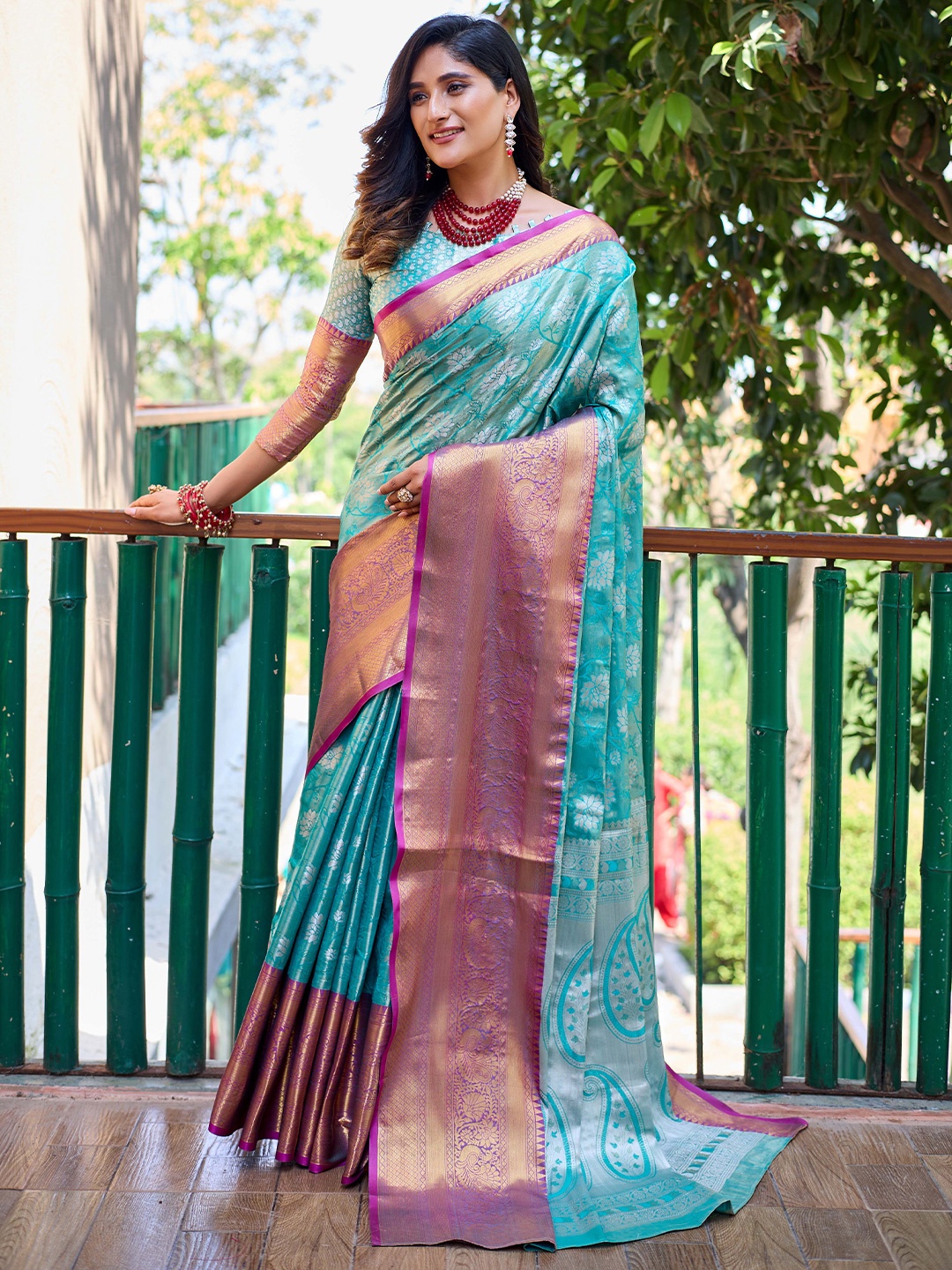 

Mitera Turquoise Blue & Purple Floral Woven Design Zari Kanjeevaram Saree