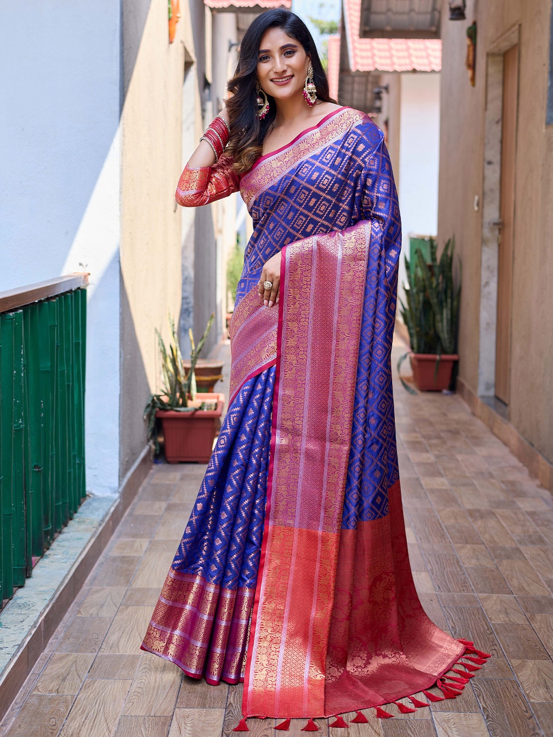 

Mitera Blue & Pink Ethnic Motifs Woven Design Zari Kanjeevaram Saree
