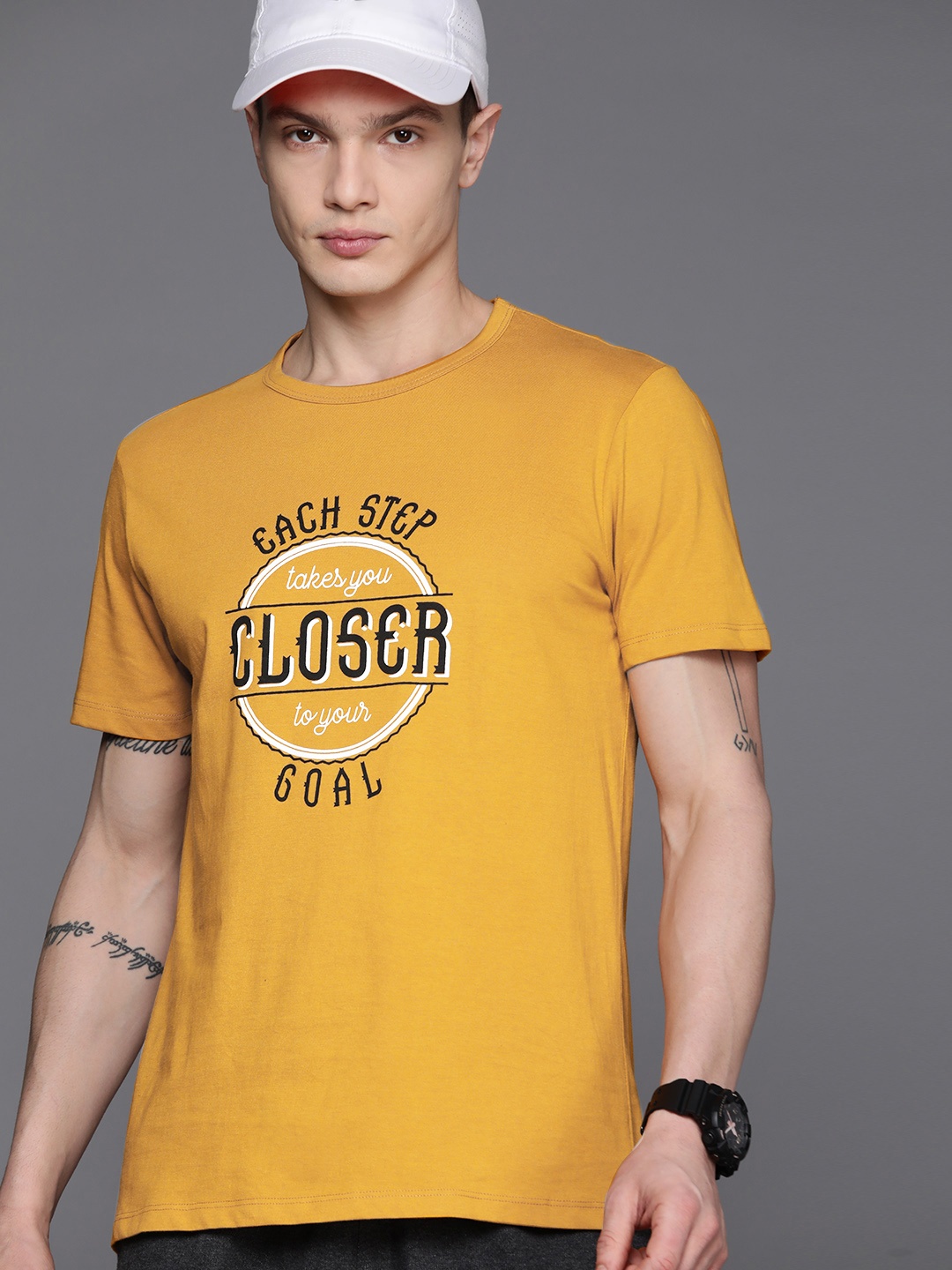 

HRX by Hrithik Roshan Men Typography Printed Regular Fit T-shirt, Mustard