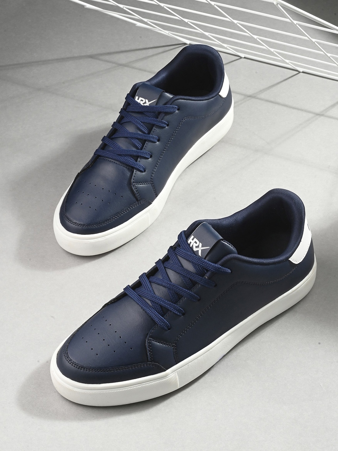 

HRX by Hrithik Roshan Men Navy Blue & White Perforated Contrast Sole Sneakers