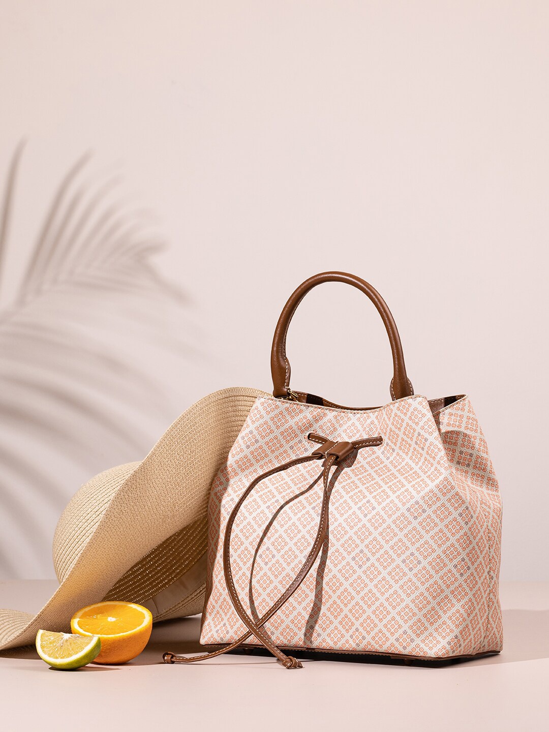

The Leather Garden Geometric Printed Structured Leather Handheld Bag, Peach