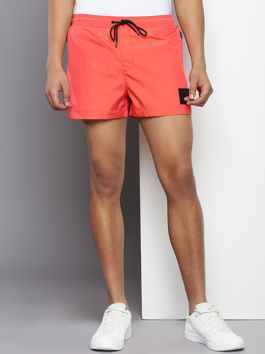 

Calvin Klein Men Mid-Rise Shorts, Coral