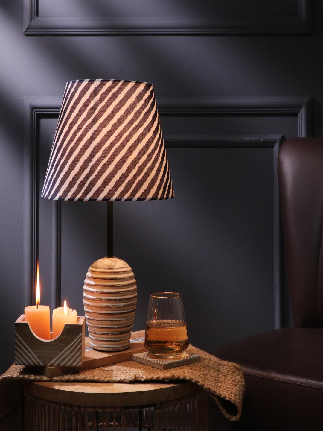 

The Decor Mart Blue and White Striped Frustum Shaped Table Lamp