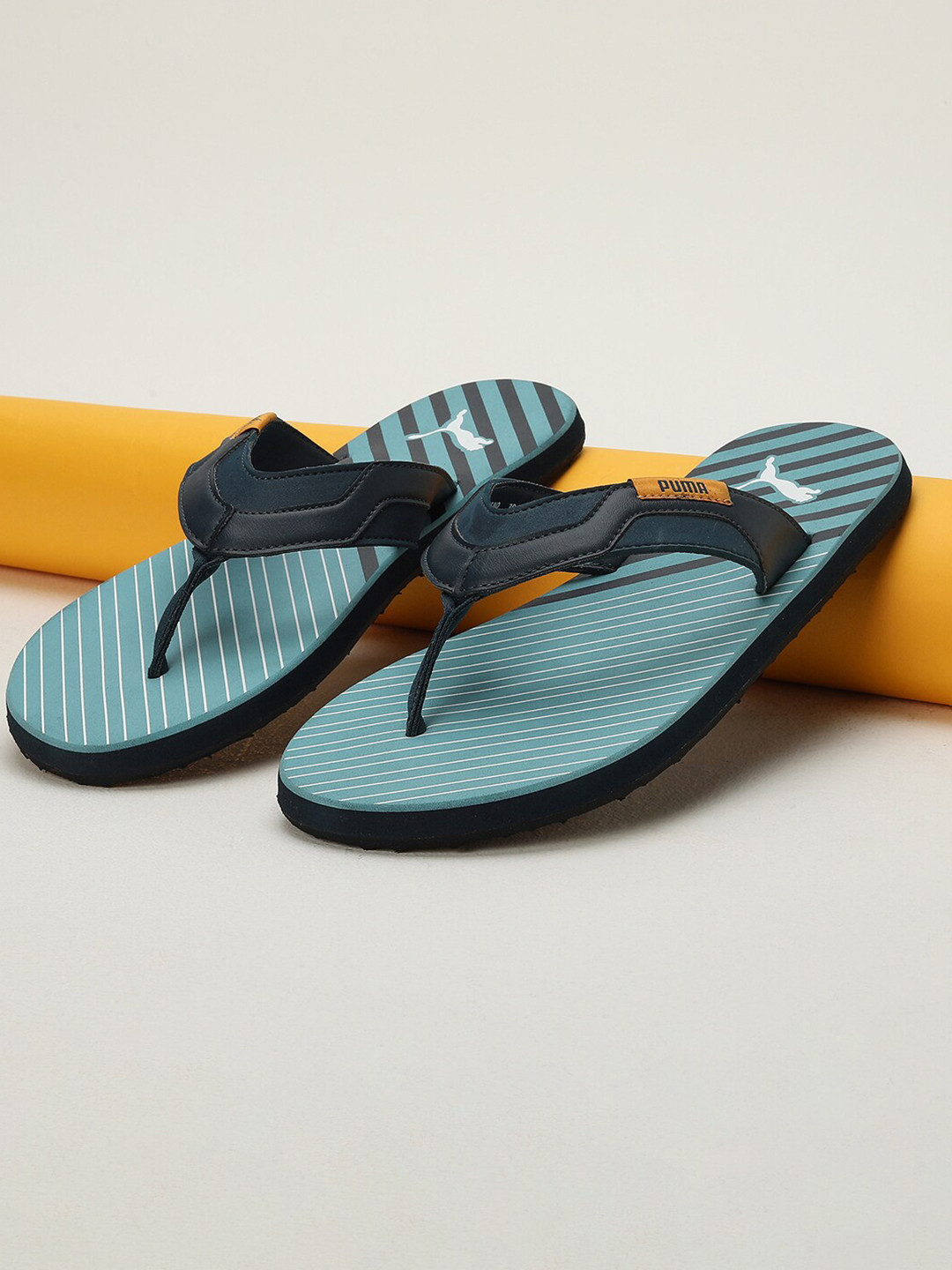 

Puma Men Plutoid Printed Thong Flip Flops, Blue