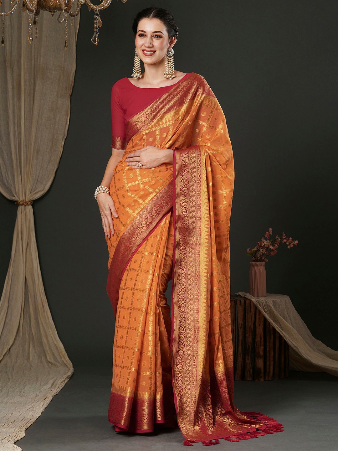 

Anouk Orange Ethnic Motifs Woven Design Zari Pure Georgette Kanjeevaram Saree