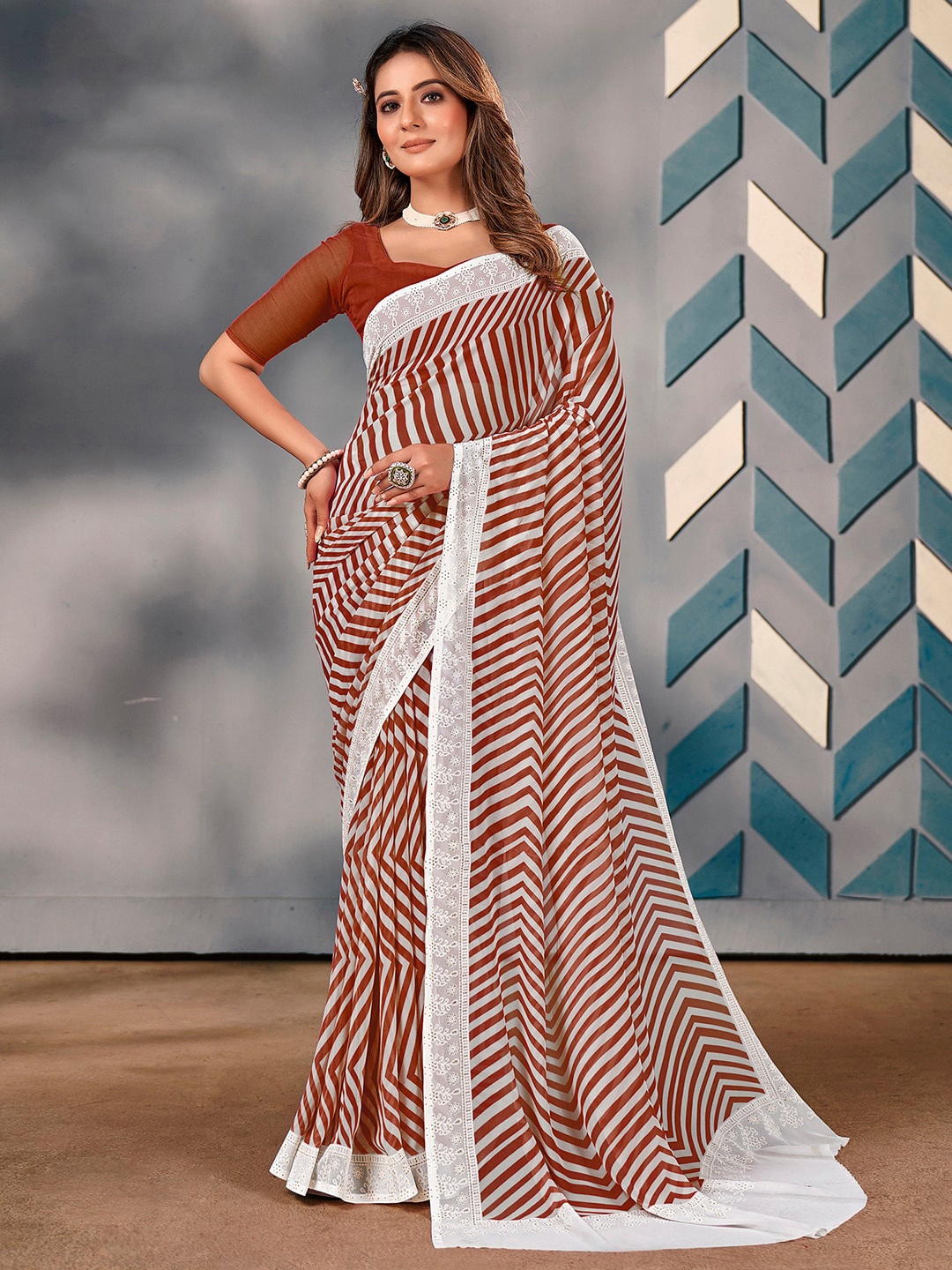 

Saree mall Striped Poly Georgette Sarees, Brown