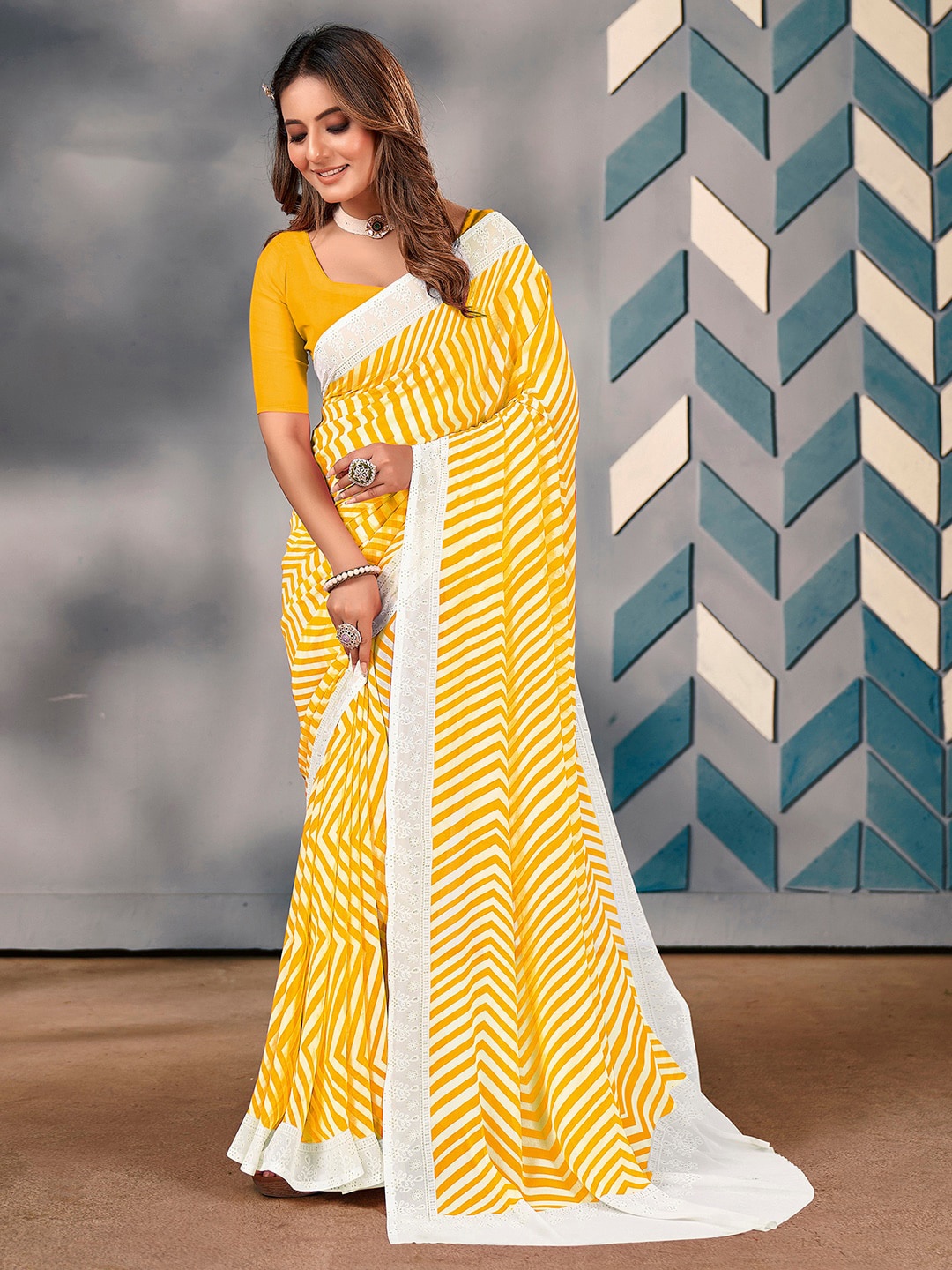 

Saree mall Yellow Striped Schiffli Poly Georgette Sarees