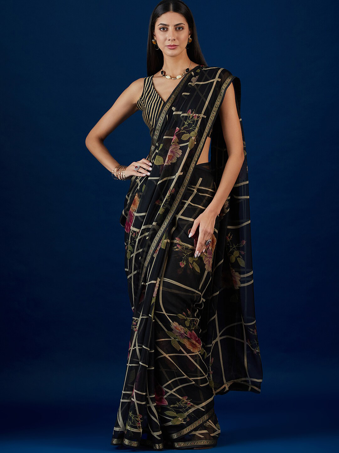 

Anouk Black & Gold Toned Floral Printed Pure Chiffon Saree With Lace Border