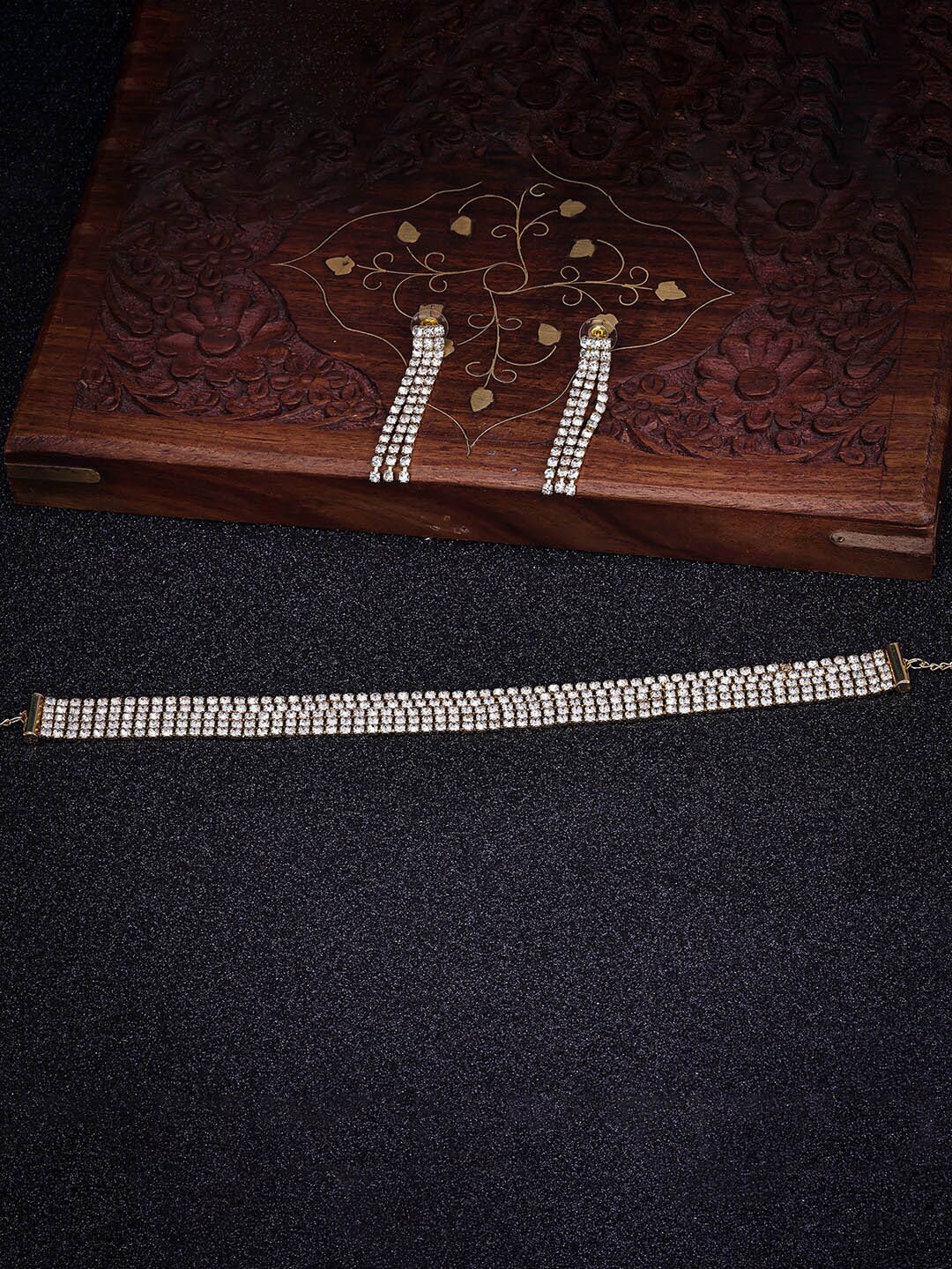 

Sukkhi Gold Plated American Diamond Stone Stubbed Jewellery Set