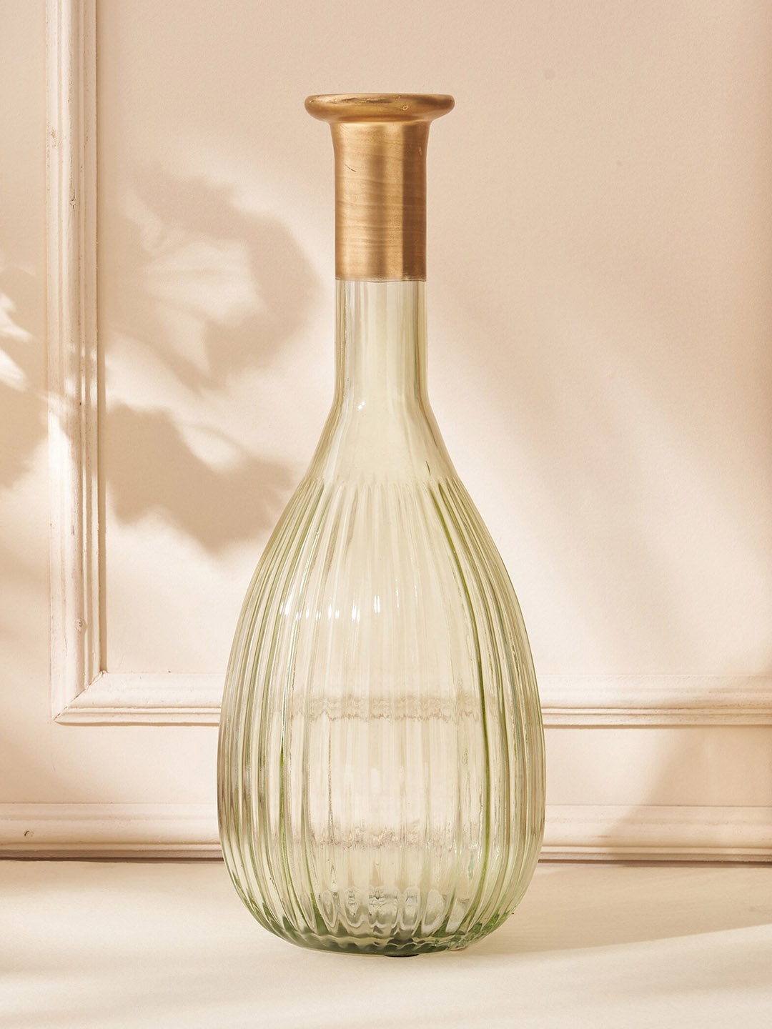 

Home Centre Moksha Neysa Green Textured Round Glass Ribbed Vase