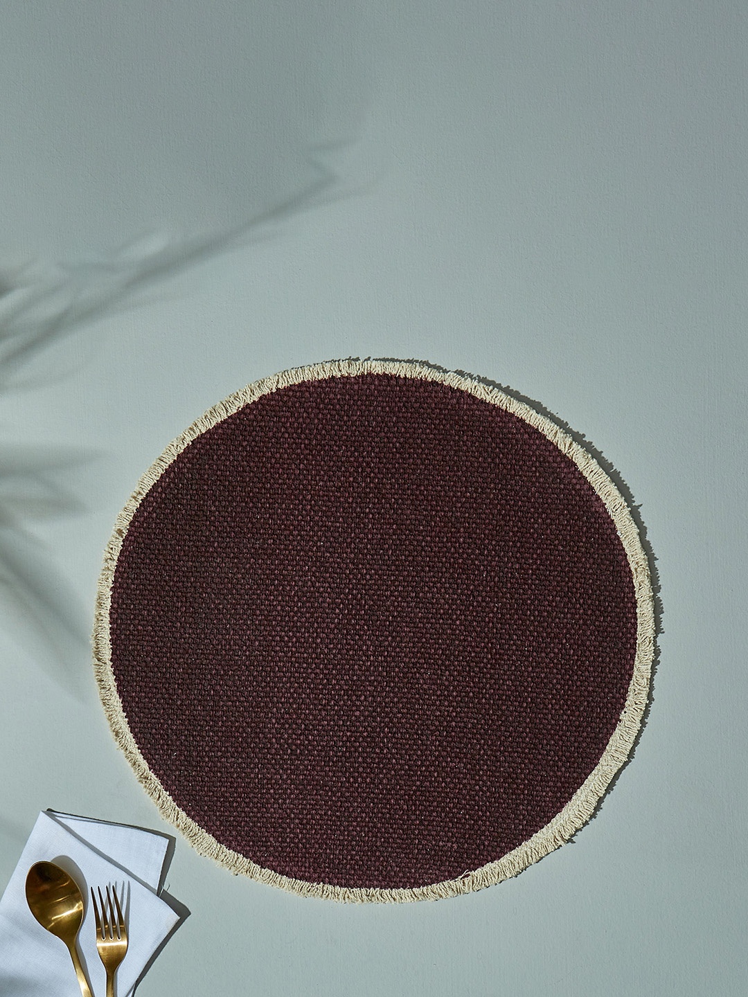 

Home Centre Maison Burgundy Solid Round Cotton Woven Table Placemat