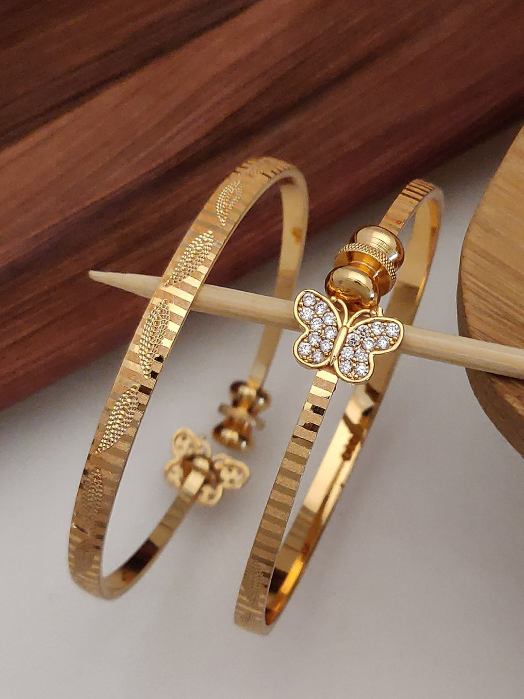 

Shining Diva Set Of 2 Gold Plated Crystal Studded Bangles