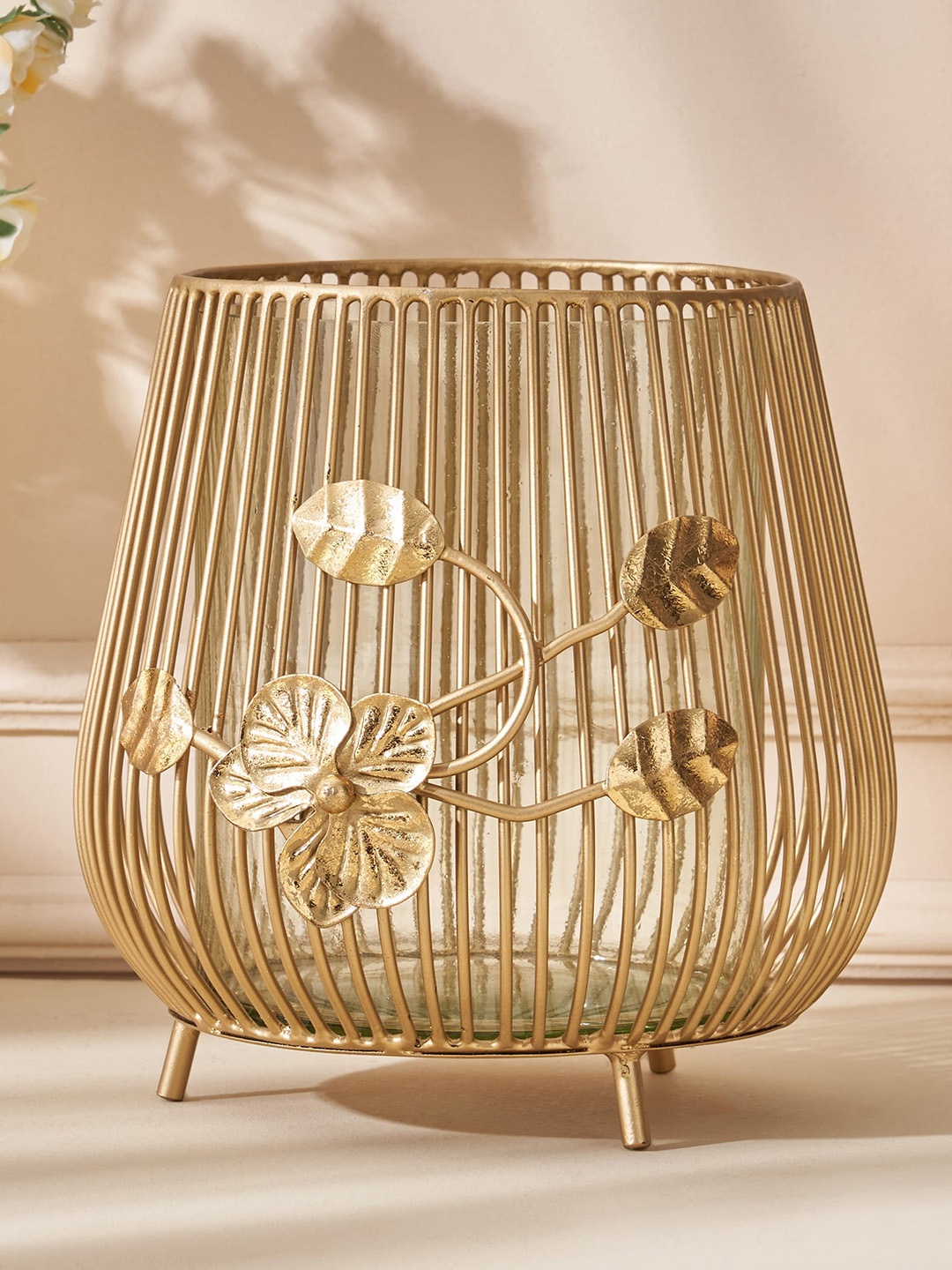 

Home Centre Moksha Neysa Gold Toned Textured Metal Hurricane Candle Holder