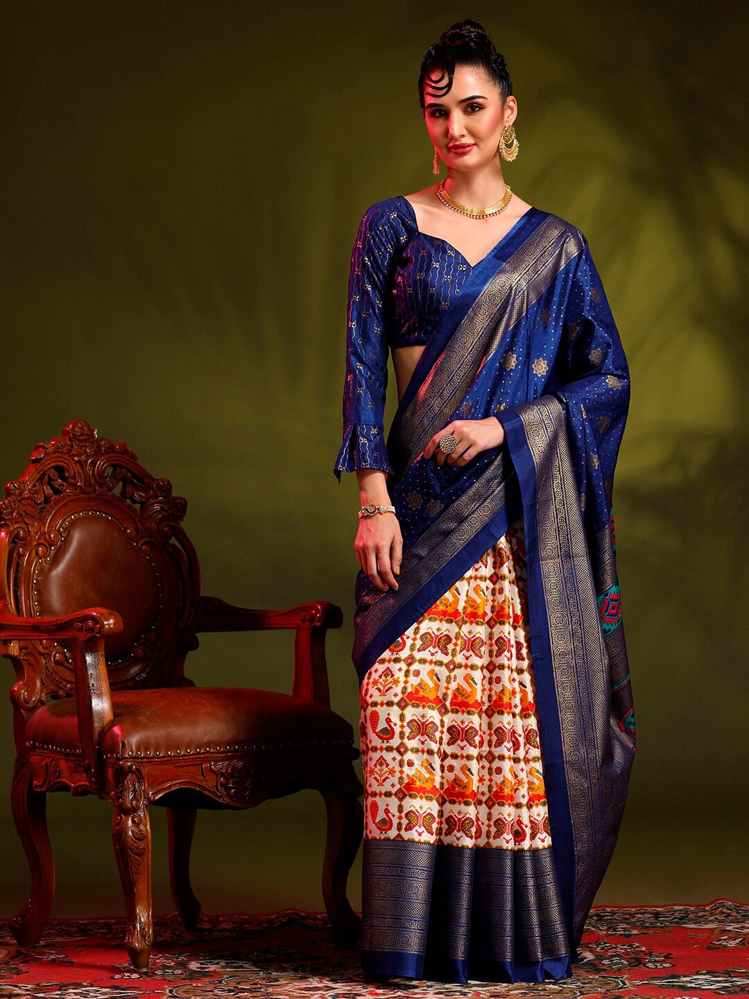 

Anouk Rustic Blue & Off White Ethnic Motifs Printed Designer Patola Saree