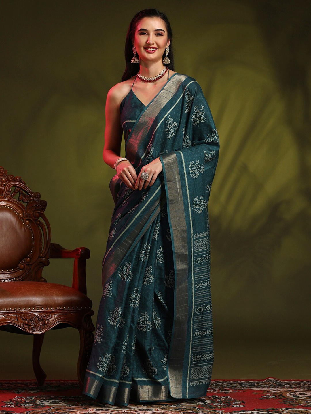 

Anouk Rustic Teal Green Ethnic Motifs Printed Zari Sungudi Saree