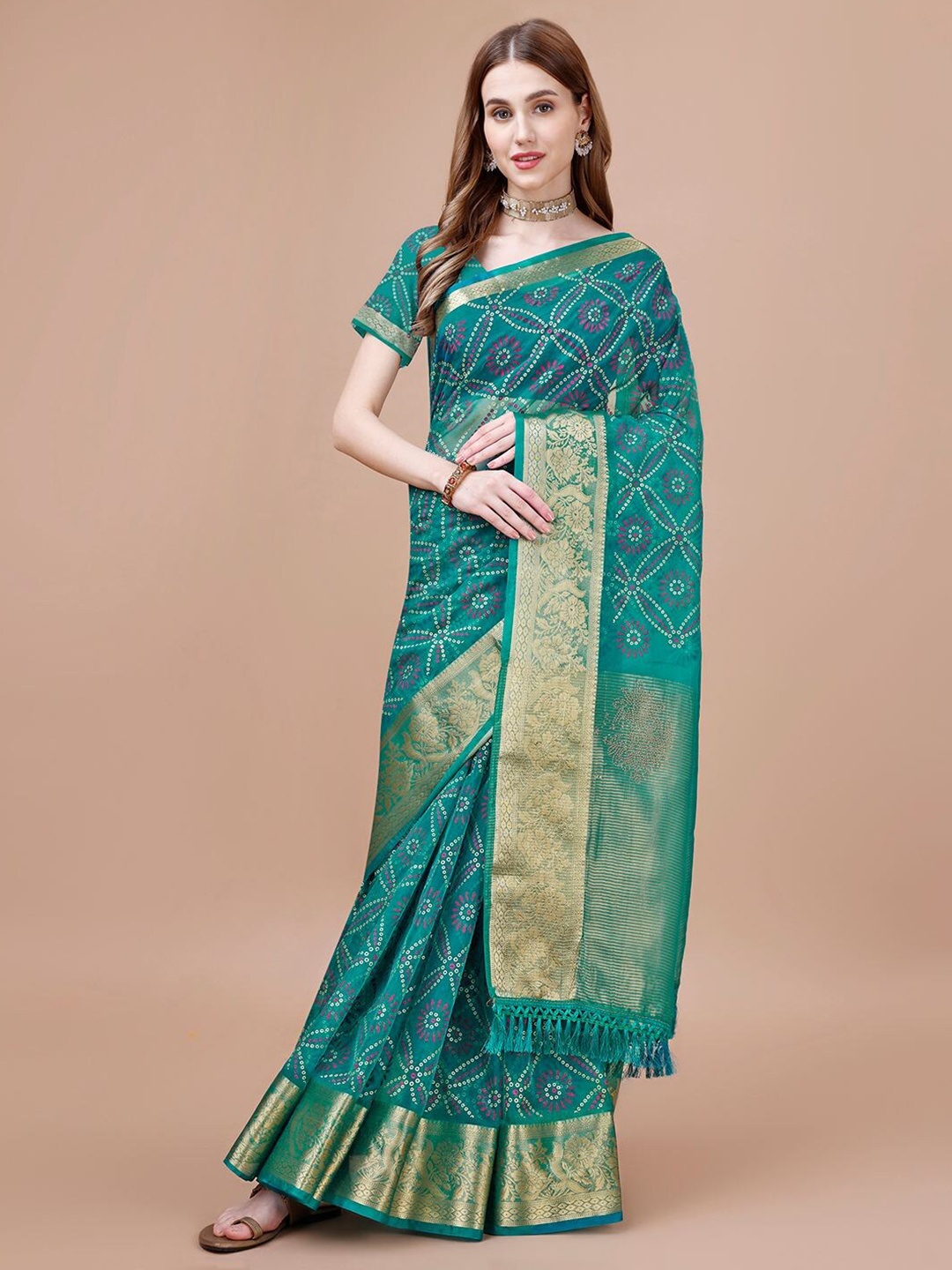 

Mitera Teal Blue & Gold Toned Ethnic Motifs Printed Zari Organza Saree