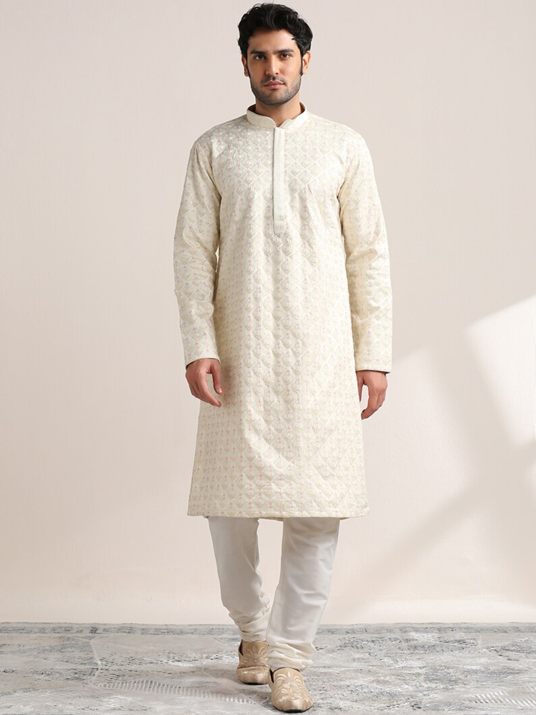 

Twamev Ethnic Motifs Embroidered Thread Work Mandarin Collar Satin Kurta With Churidar, Cream