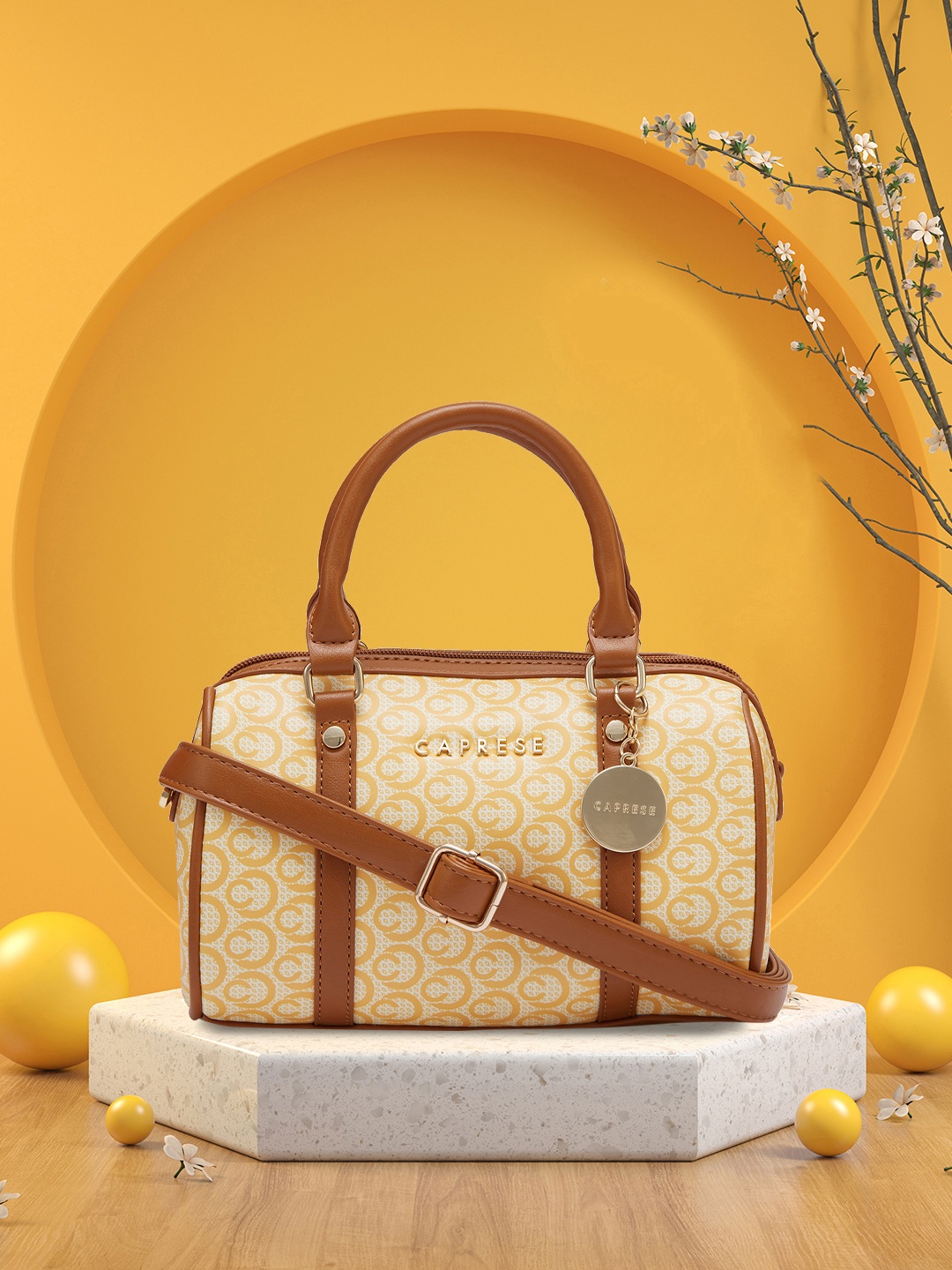 

Caprese Abstract Printed Leather Bowling Handheld Bag, Yellow