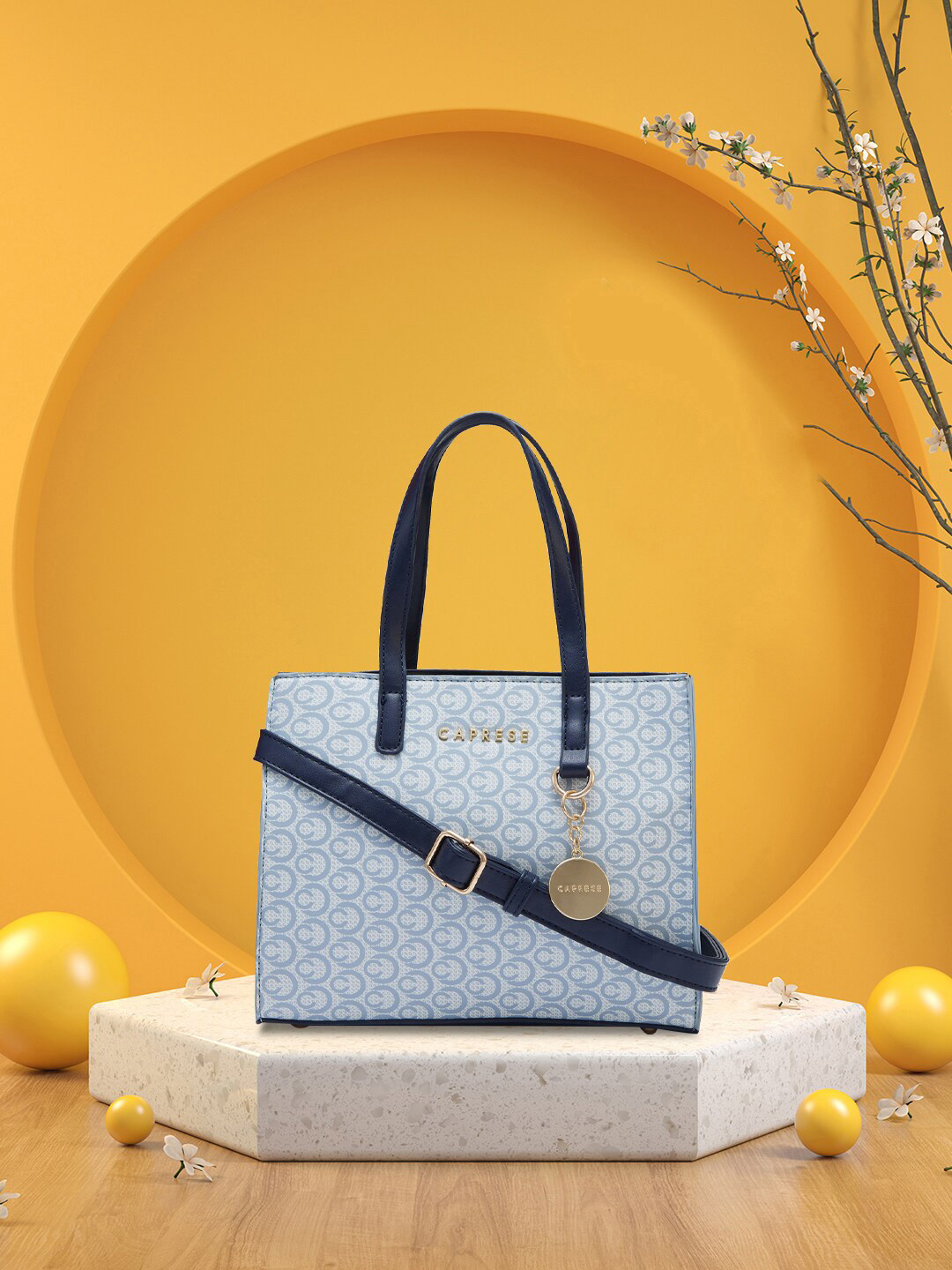 

Caprese Abstract Printed Leather Structured Handheld Bag, Navy blue