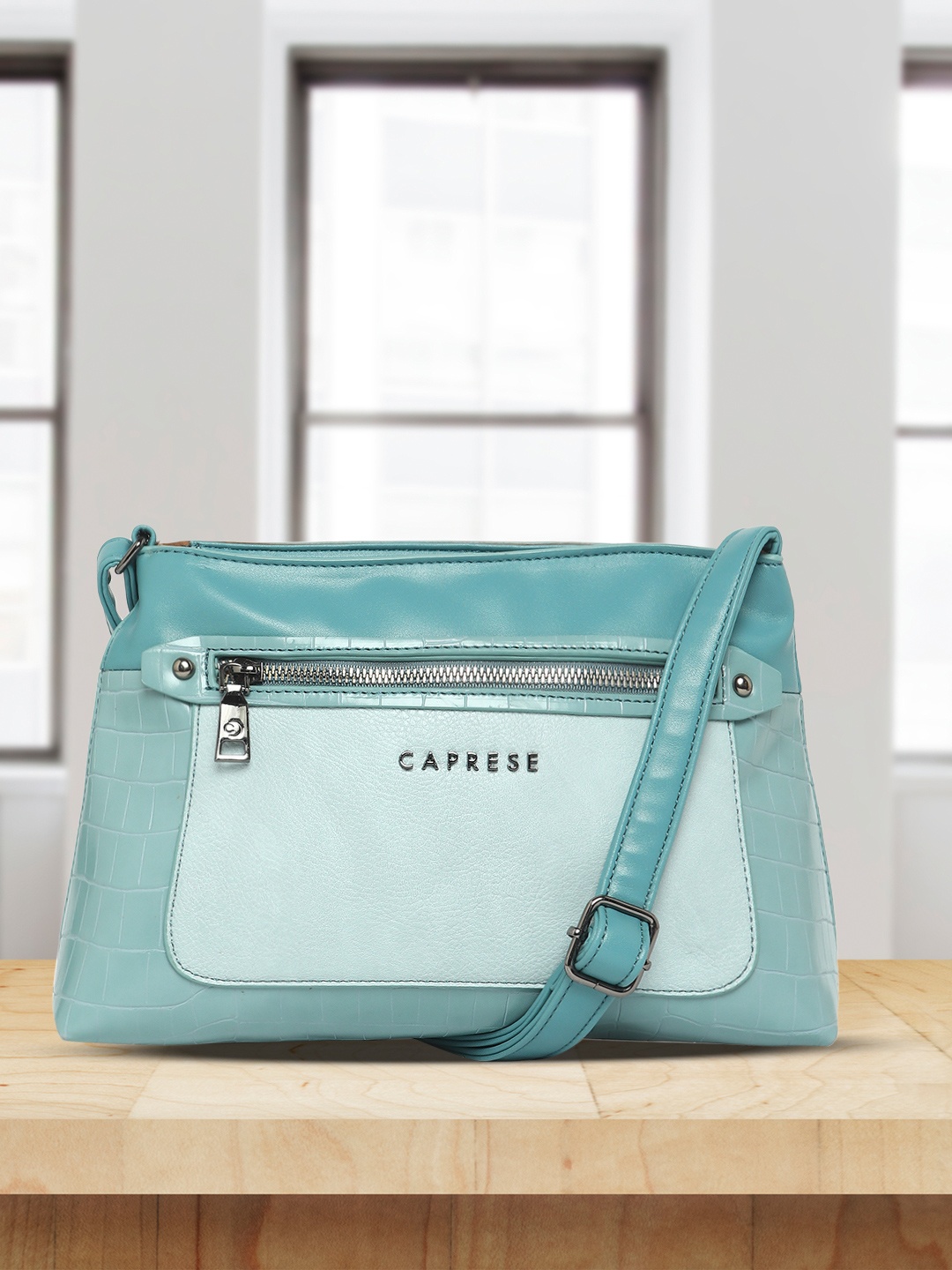 

Caprese Colourblocked Leather Structured Sling Bag, Blue