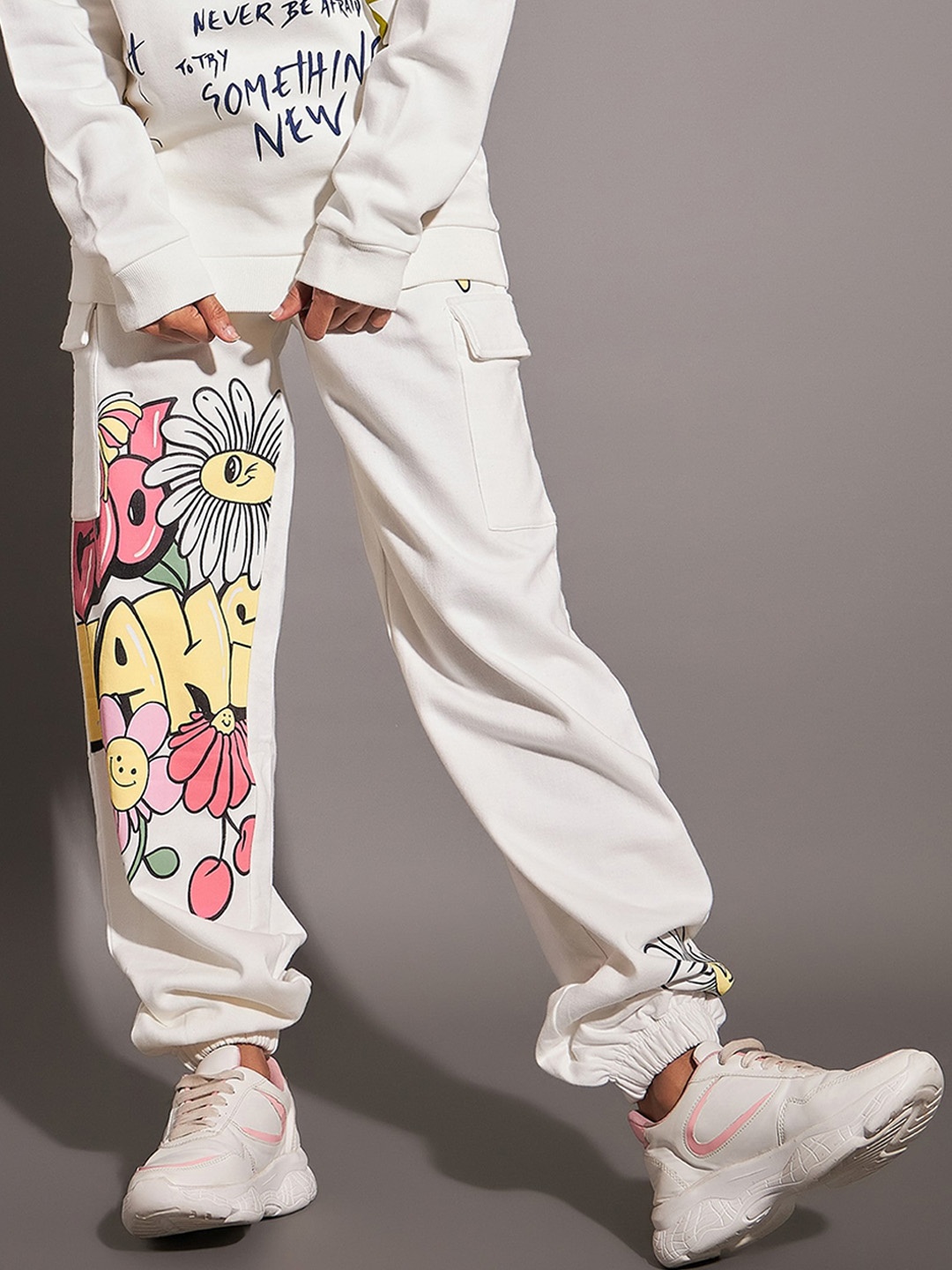 

SASSAFRAS Women Black Relaxed Fit Mid-Rise Graphic Printed Cotton Joggers, Off white