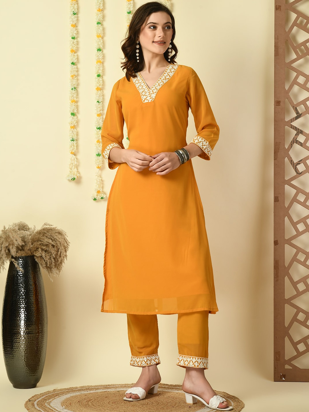 

Sangria Ethnic Motifs Yoke Design V-Neck Straight Thread Work Kurta with Trousers, Mustard