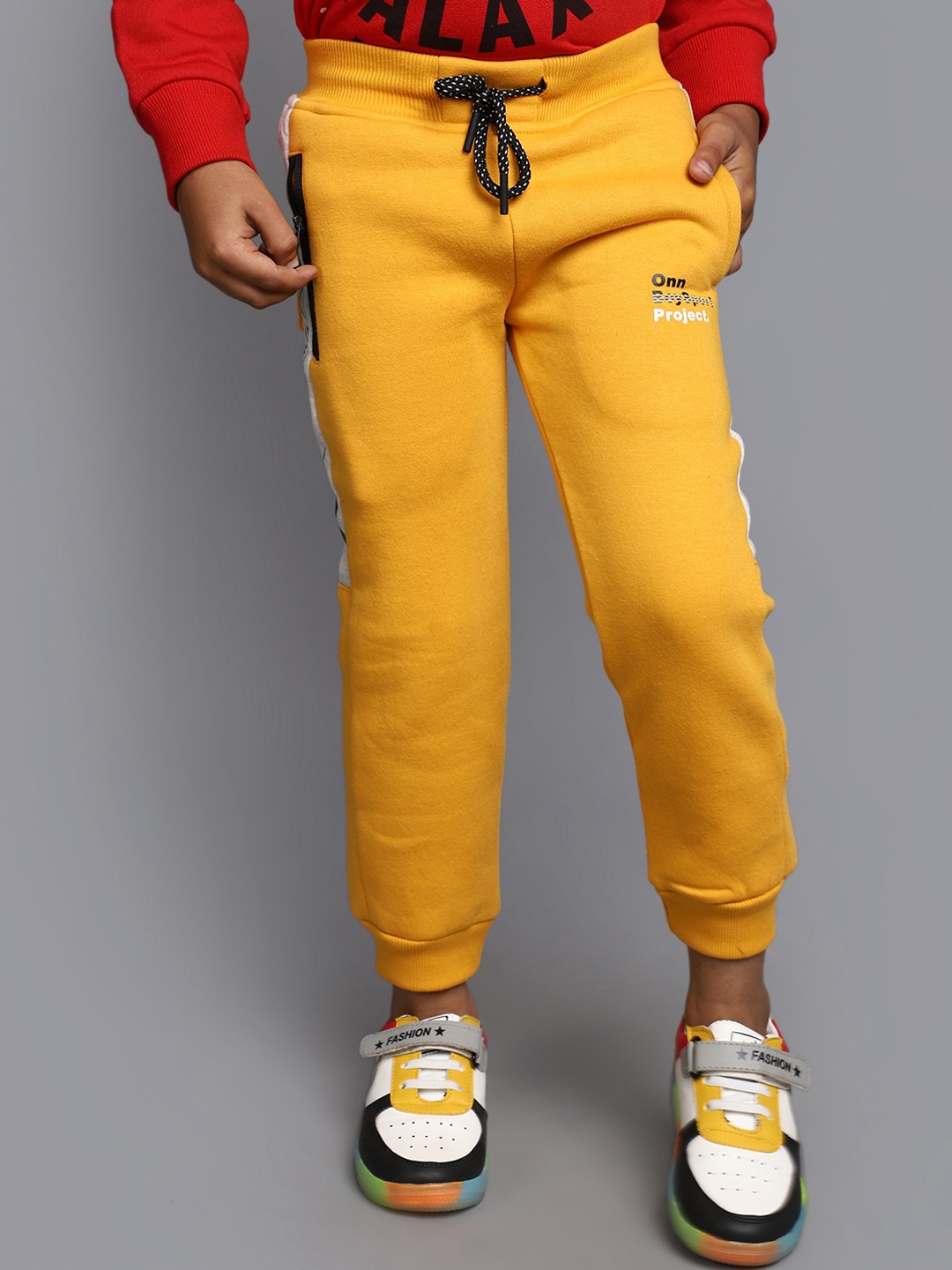 

V-Mart Boys Typography Printed Mid-Rise Joggers, Yellow