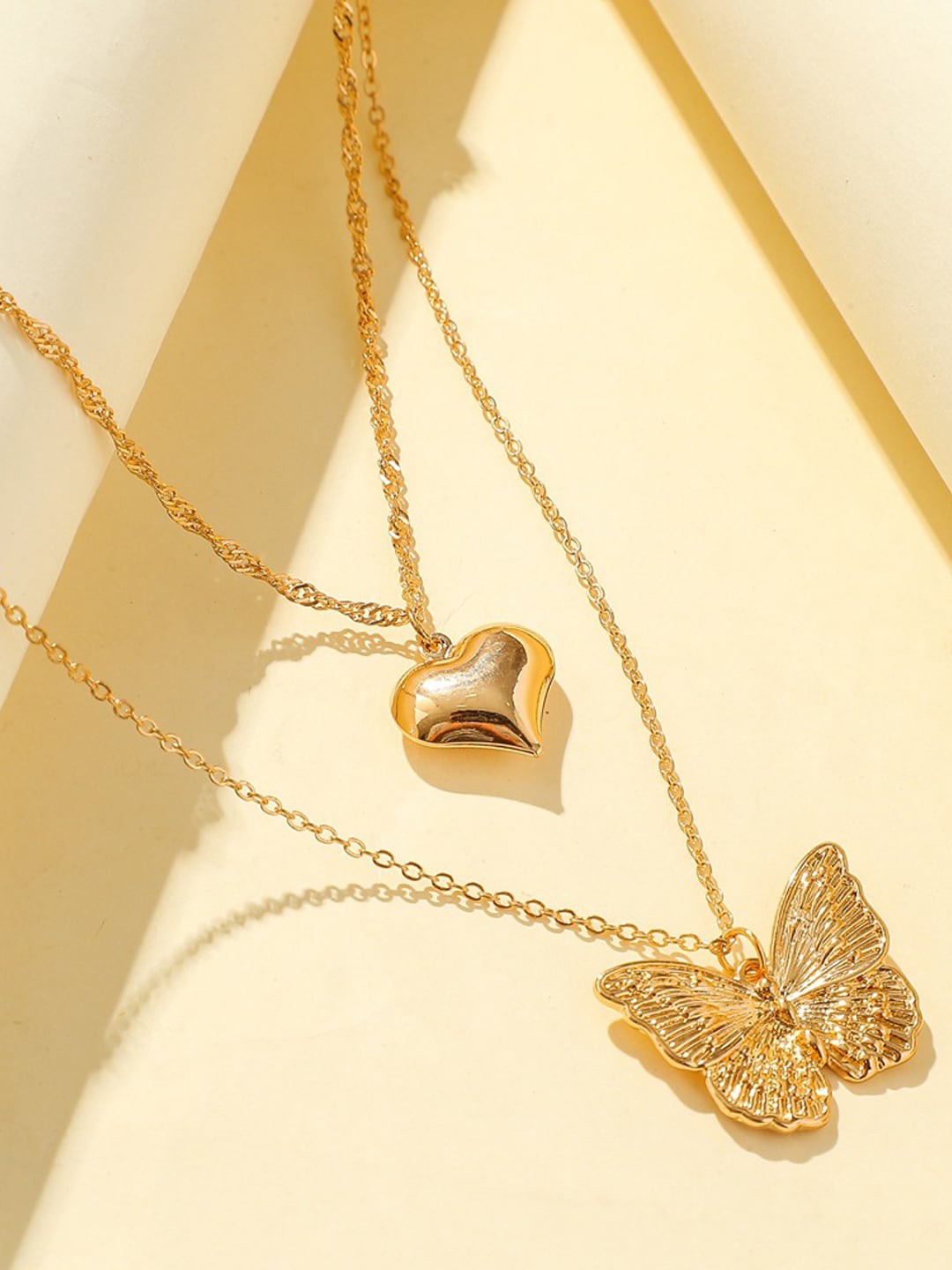 

FIMBUL Gold Plated Heart and Butterfly Design Double Layered Neck Chain