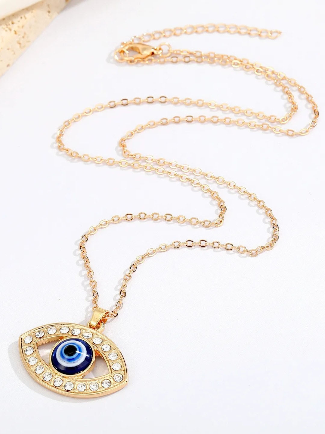 

VAGHBHATT Gold-Plated Artificial Stones Evil Eye Charm Pendent With Chain