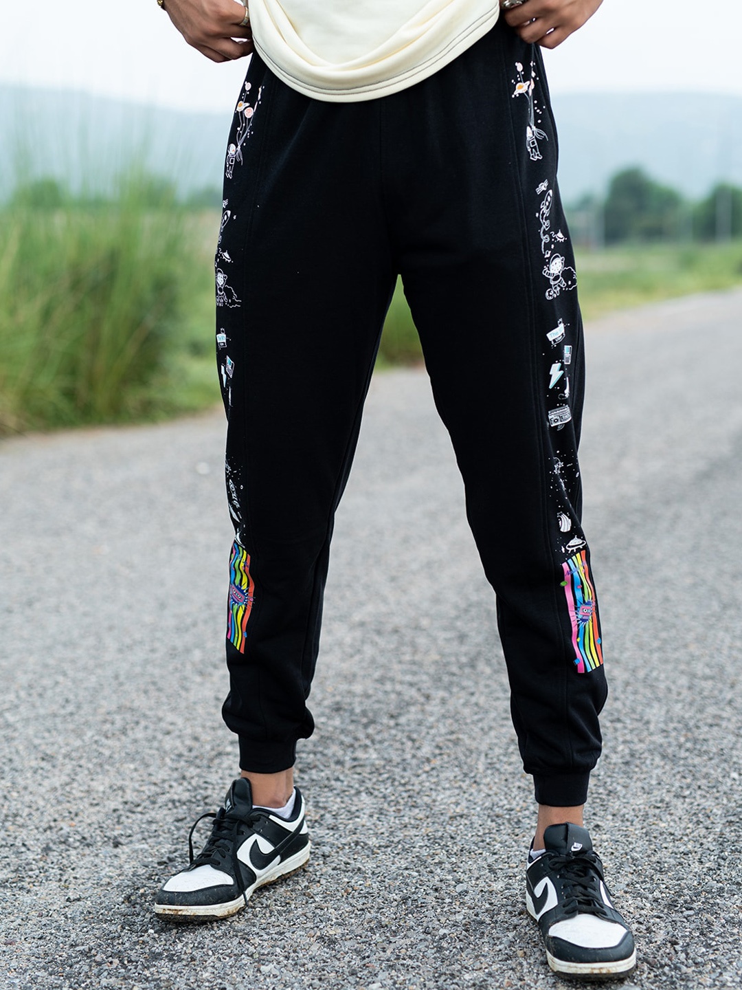 

Tistabene Men Conversational Printed Relaxed Fit Mid Rise Cotton Joggers, Black