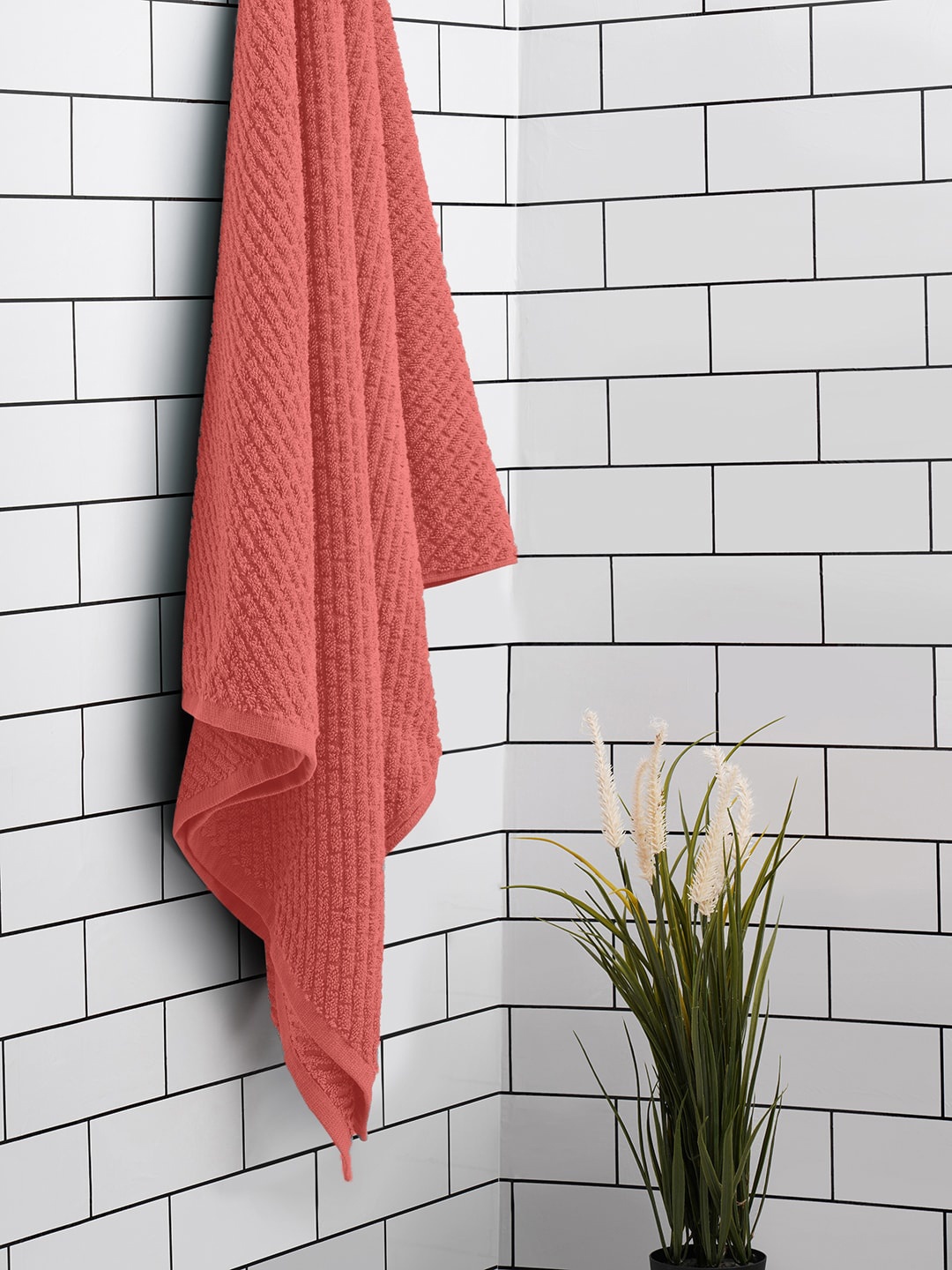 

SPACES Peach-Coloured Textured 400 GSM Pure Cotton Bath Towel